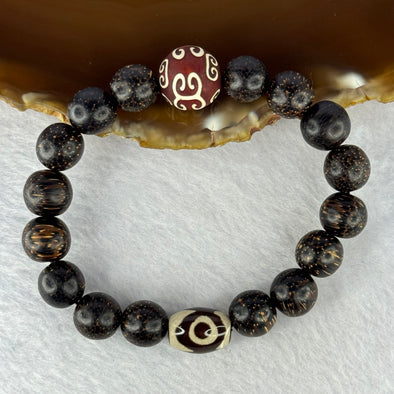 Natural Agarwood With 3 Eyes Dzi Bead Tian Zhu Beads Bracelet 天然沉香带三眼天珠手链 17.96g 16.5cm Dzi 13.9 by 13.4mm and 14.0mm 1 Bead and 10.8mm 16 Beads - Huangs Jadeite and Jewelry Pte Ltd