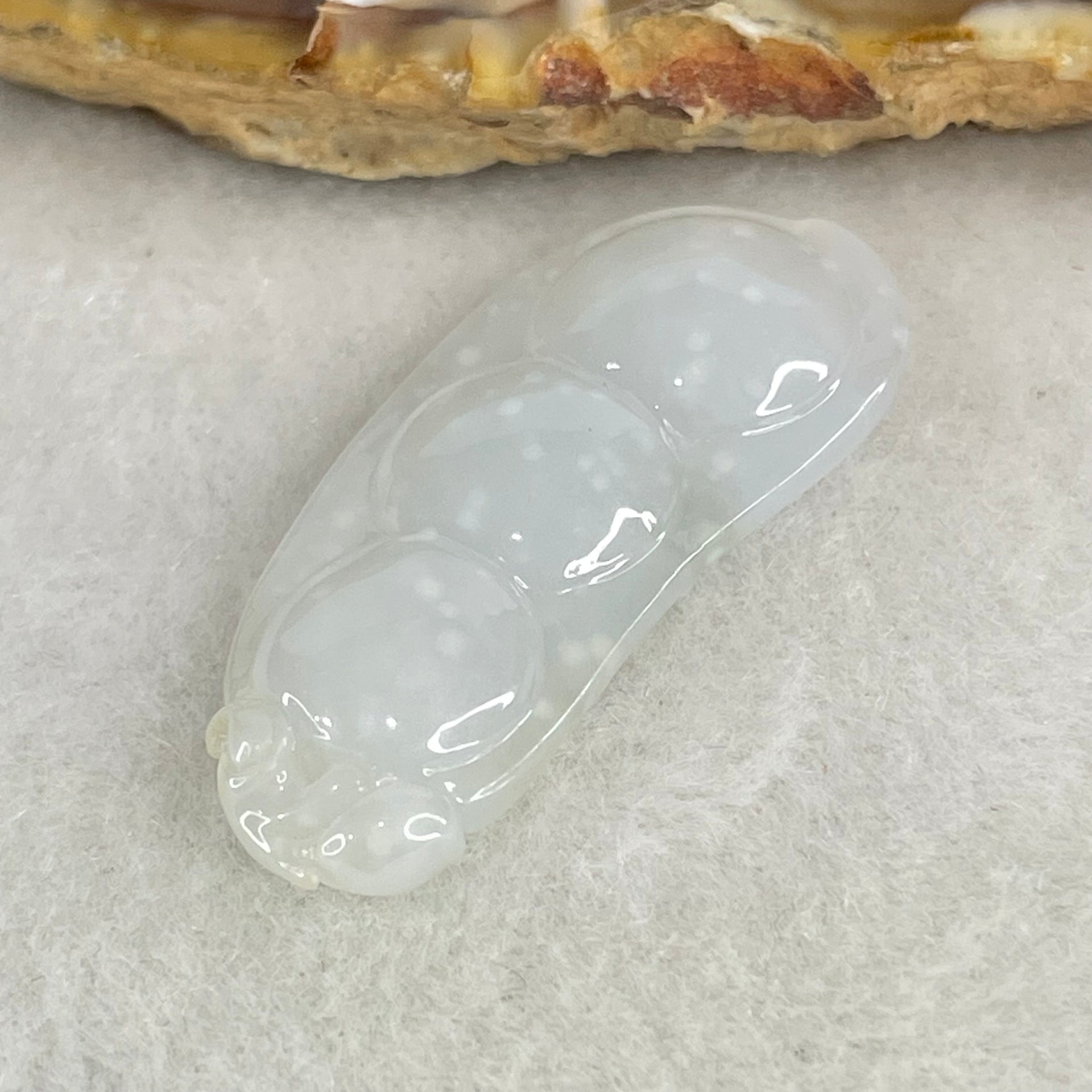 Type A Semi Icy Faint Green with Muna Jadeite Peapod Pendant 5.34g 35.5 by 15.5 by 5.9mm - Huangs Jadeite and Jewelry Pte Ltd