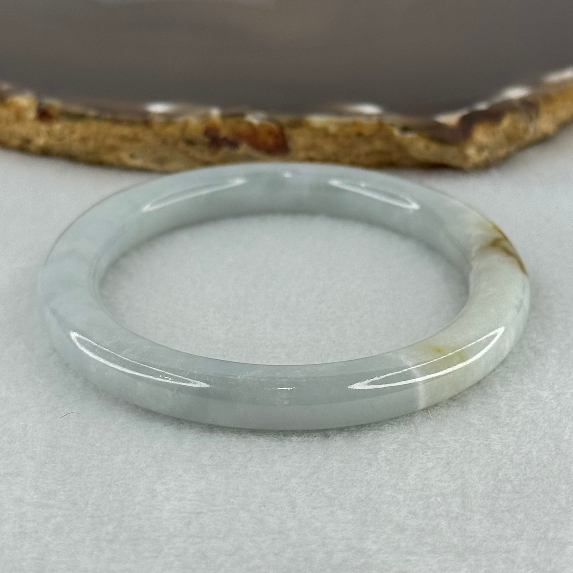 Type A Sky Blue with Green and Brown Patch Jadeite Oval Bangle Internal Diameter 58.0mm 32.09g 7.4 by 7.9mm (External Rough with Internal Lines) - Huangs Jadeite and Jewelry Pte Ltd