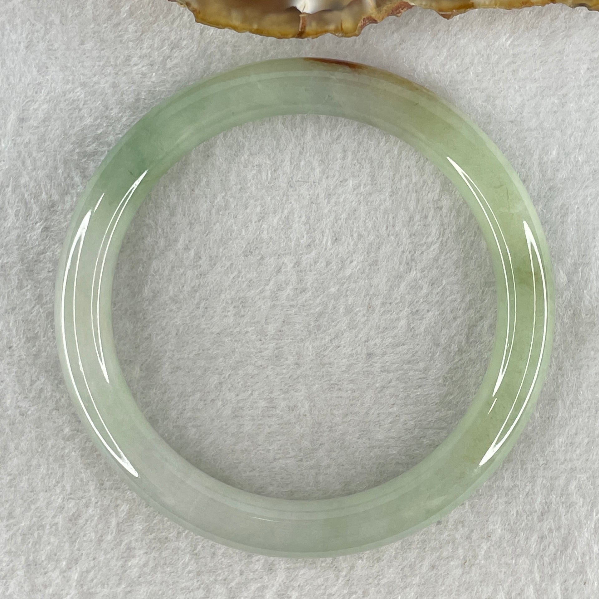 Natural Type A Light Green with Yellow Brown Patch Jadeite Bangle 38.72g Inner Diameter 56.5mm Thickness 8.7 by 8.6mm (Internal Lines) - Huangs Jadeite and Jewelry Pte Ltd