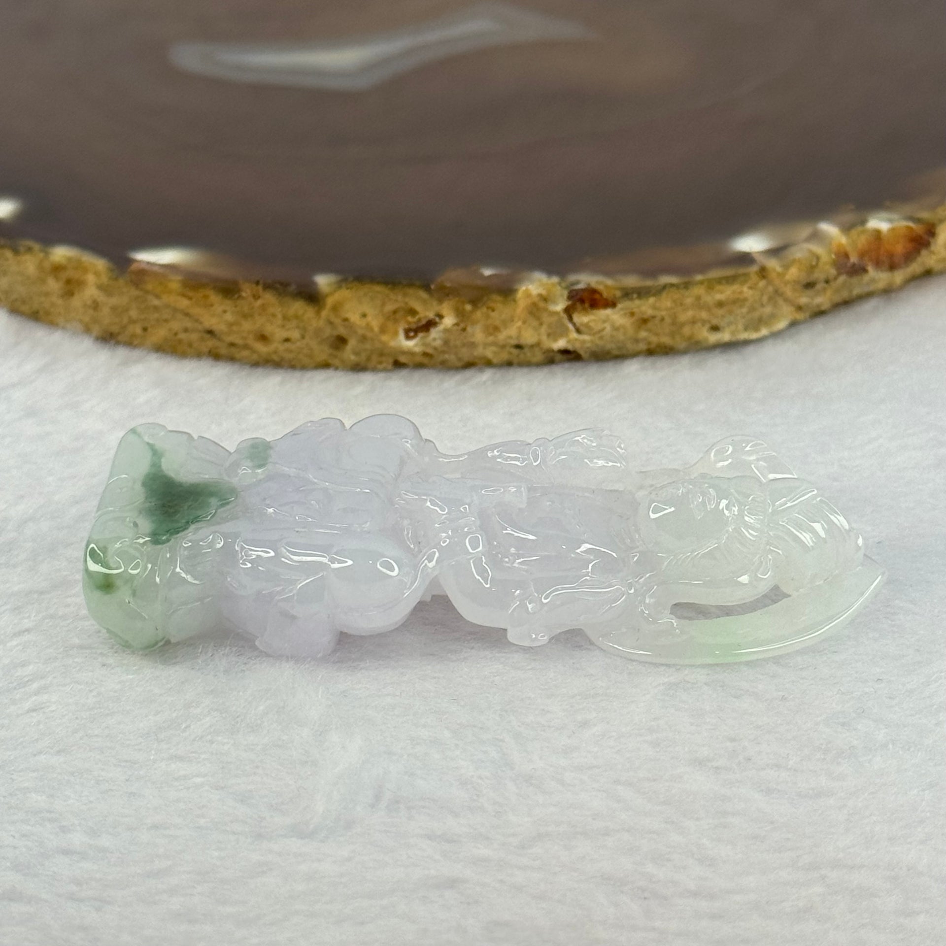 Type A Light Lavender with Green Patches Jadeite Guan Yin Pendent with Wooden Stand 111.55g  111.8 by 58.7 by 46.6mm - Huangs Jadeite and Jewelry Pte Ltd