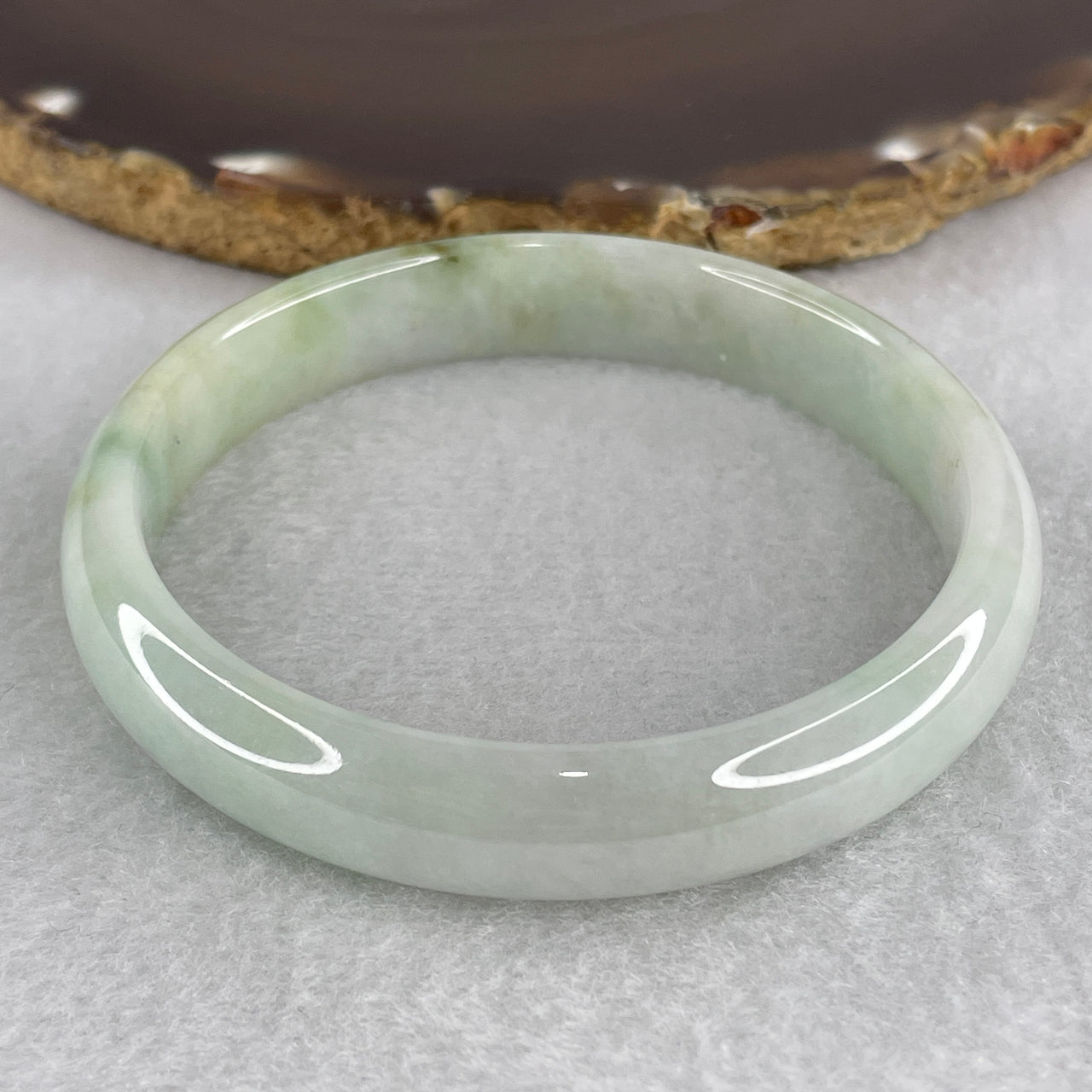 Natural Type A Jadeite Bangle – Light Green with Yellowish Piao Hua | Symbol of Wealth, Harmony & Abundance 40.65g Inner Diameter 59.9mm 11.5 by 7.3mm (Slight Internal Lines)