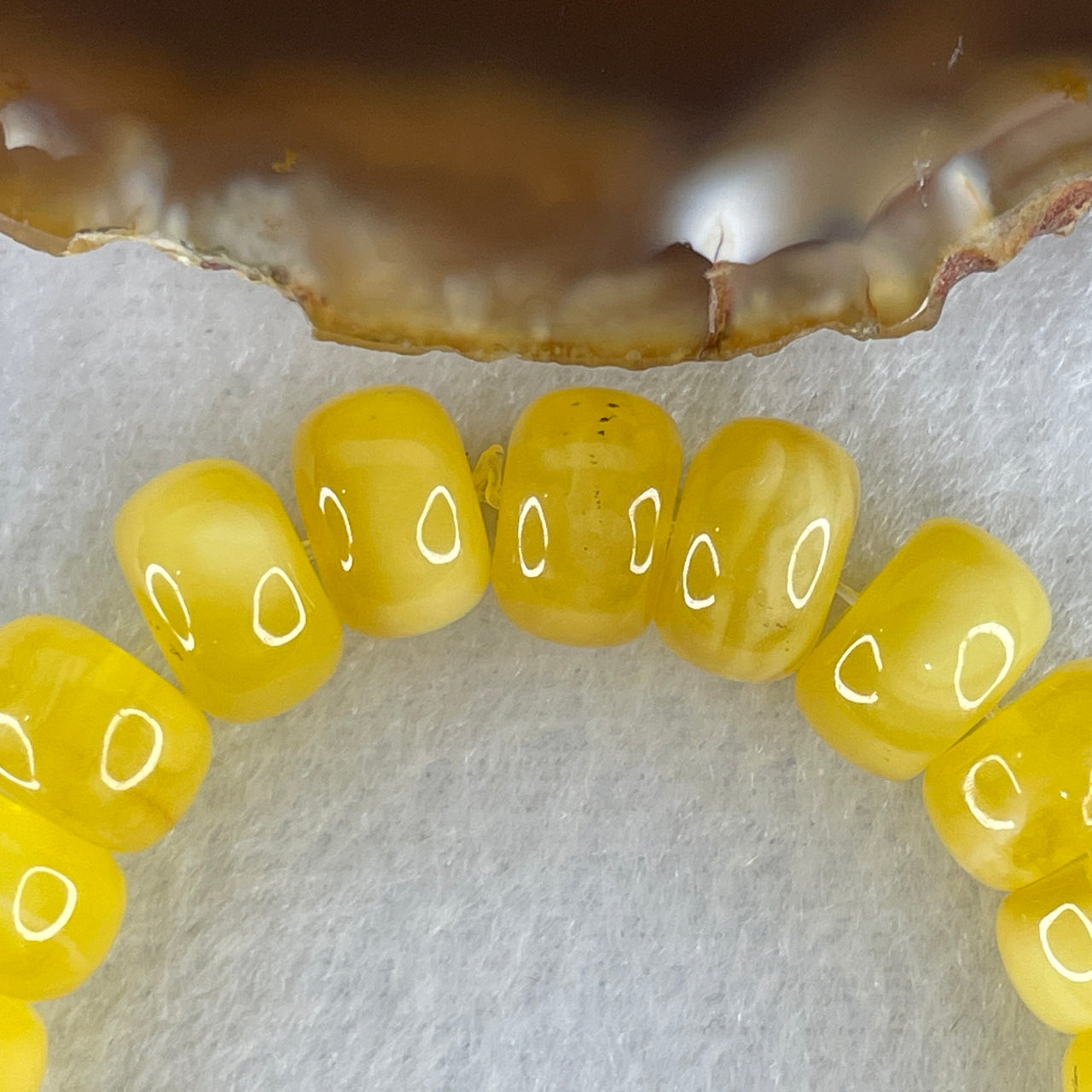 Natural Butterscotch Amber Donut Beads with Fish Charm Bracelet 13.93g 10.4mm 25 Beads - 24.8 by 16.5 by 5.3mm Fish