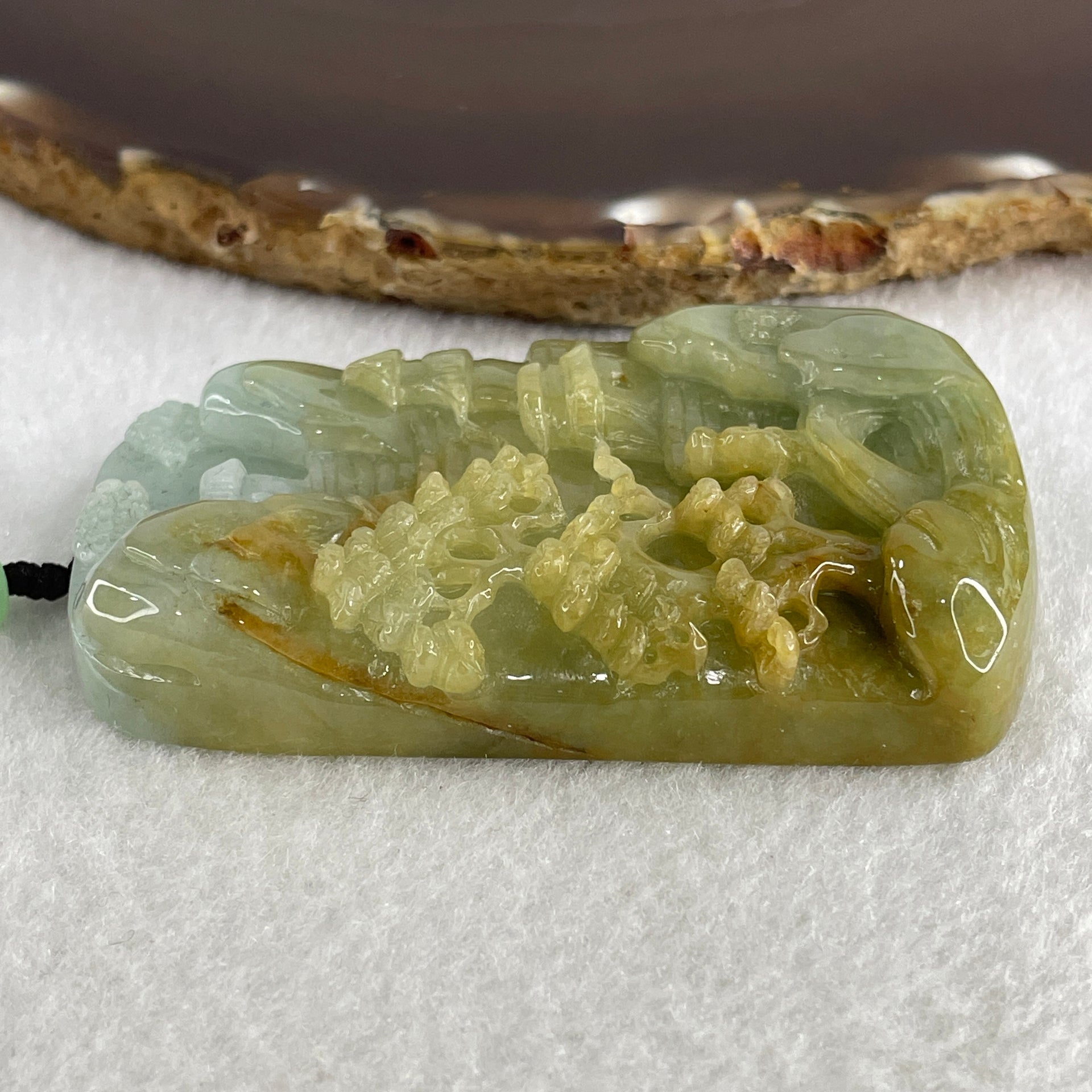 Natural Type A Yellowish Green with Sky Blue Jadeite Shan Shui with Gui Ren Benefactor Pendant 76.29g 67.4 by 43.0 by 12.0mm - Huangs Jadeite and Jewelry Pte Ltd