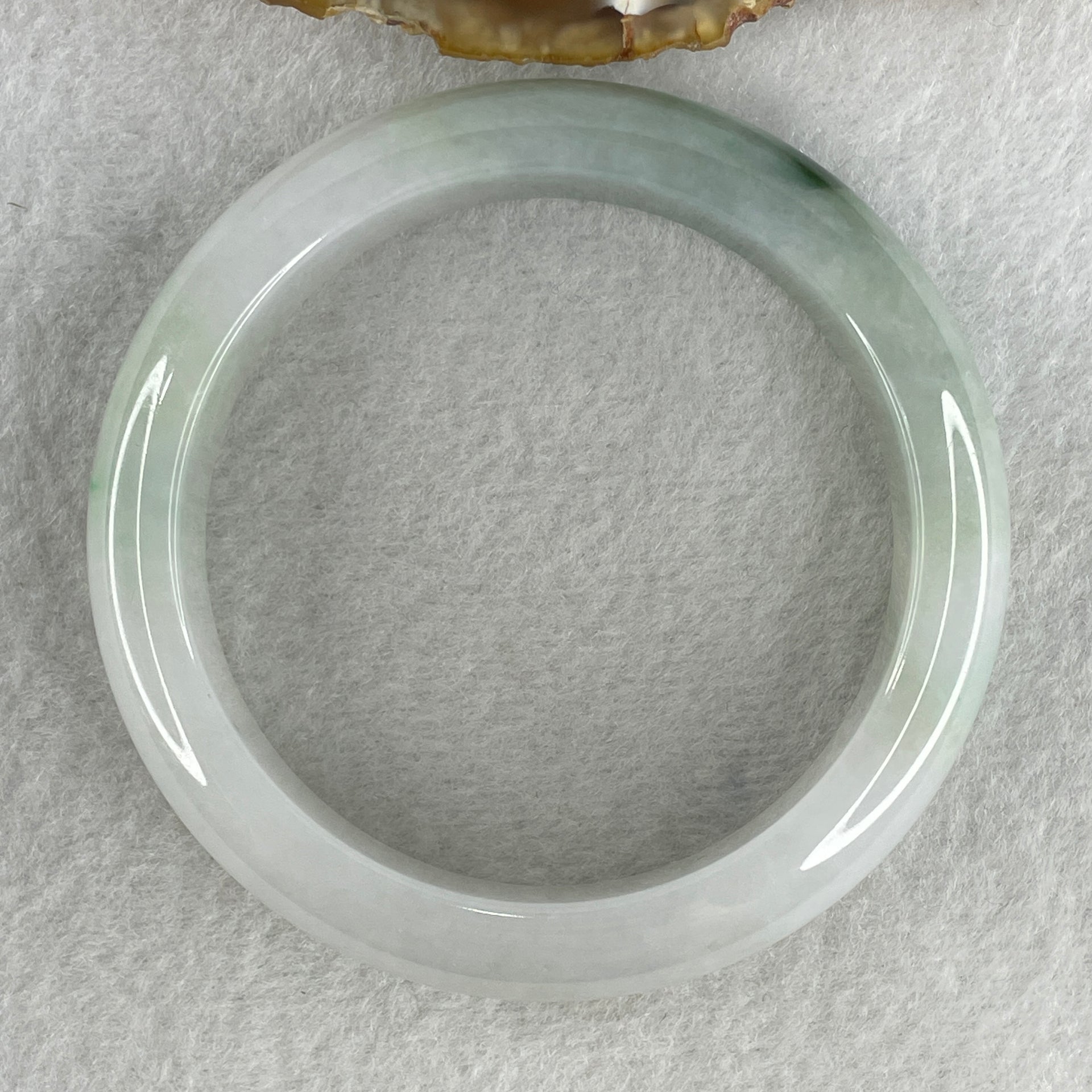 Type A Natural Jelly Light Green with Faint Lavender with Spicy Green Spot Jadeite Bangle 70.15g Inner Diameter 57.8mm 14.3 by 9.6mm (Close to Perfect) - Huangs Jadeite and Jewelry Pte Ltd