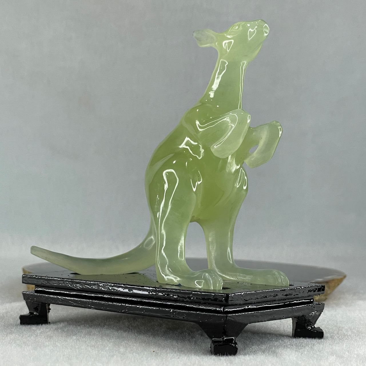 Natural Green Serpentine Kangaroo with Wooden Stand Display 172.6g 100.8 by 63.0 by 115.0mm - Huangs Jadeite and Jewelry Pte Ltd