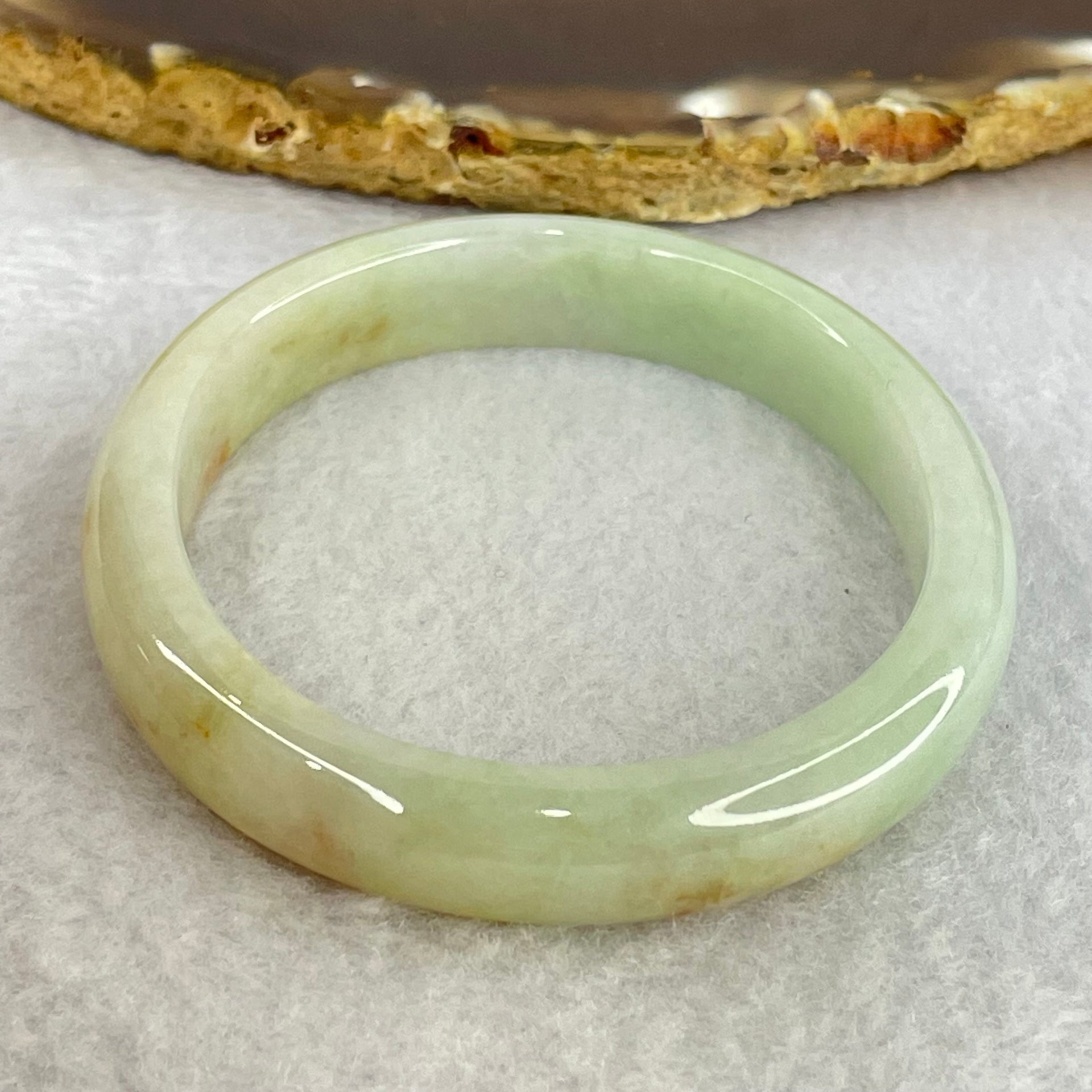 Type A Light Blueish Green and Red and Brown Patches Jadeite Oval Bangle Internal Diameter 54.3mm 32.17g 10.4 by 6.5mm (Very Slight Internal Lines) - Huangs Jadeite and Jewelry Pte Ltd