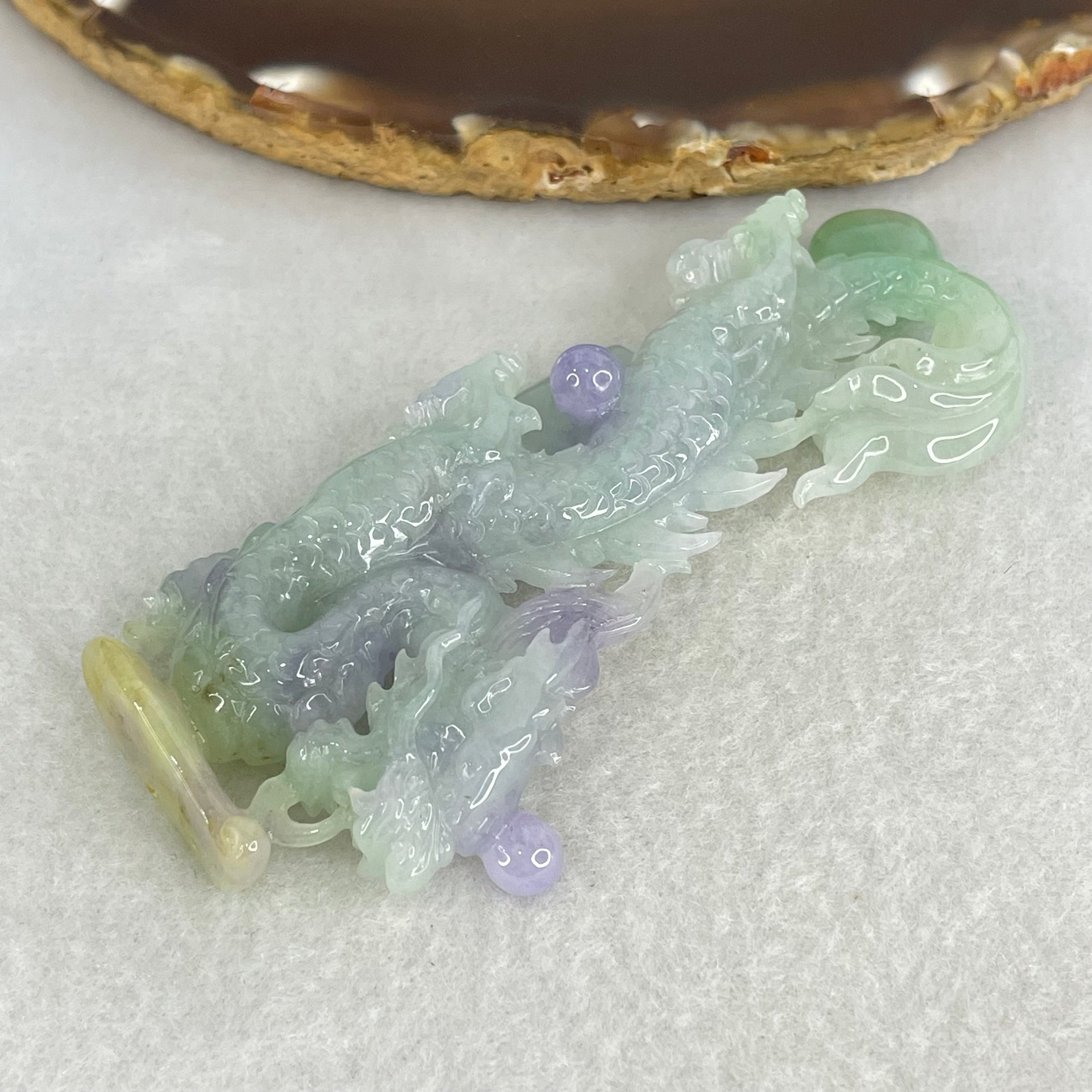 Type A Light Green with Deep Bright Lavender and Yellow Jadeite Pendant 45.66g 8.3 by 3.9 by 11mm with Wooden Stand - Huangs Jadeite and Jewelry Pte Ltd