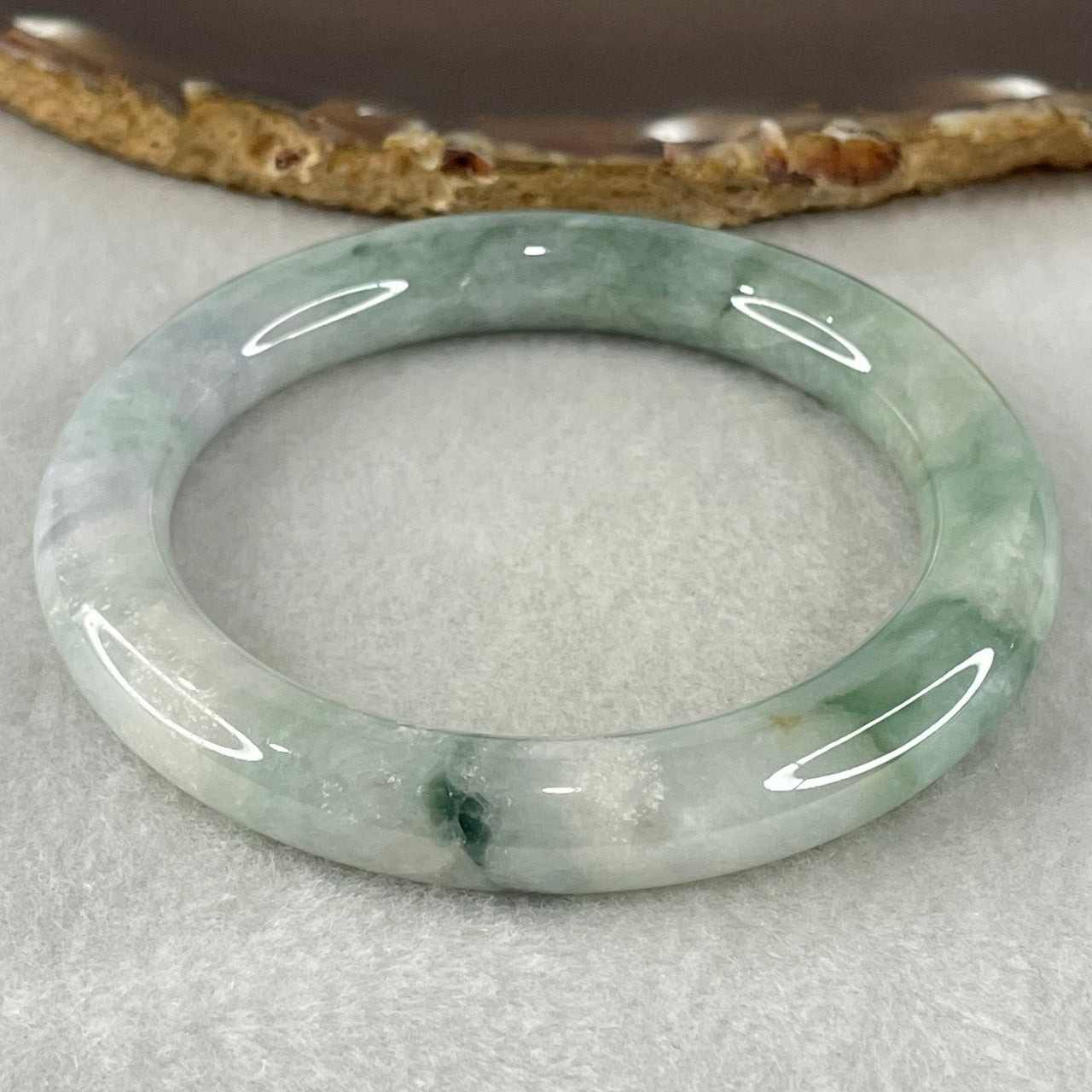 Type A Light Green with Green piao Hua Floral Jadeite Bangle 54.80g Inner Diameter 55.9mm 10.2 by 10.6mm (Internal Lines) - Huangs Jadeite and Jewelry Pte Ltd