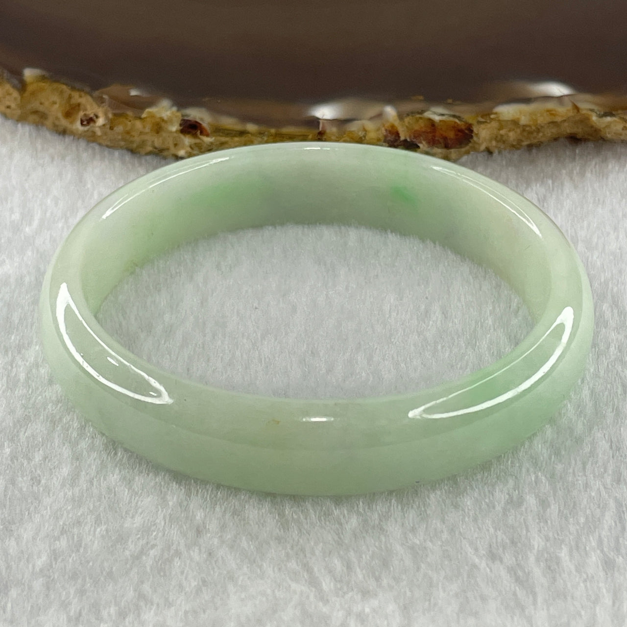 Natural Type A Light Green Jadeite Oval Bangle 36.17g Inner Diameter 54.6mm 12.5 by 6.4mm (Internal Lines) - Huangs Jadeite and Jewelry Pte Ltd