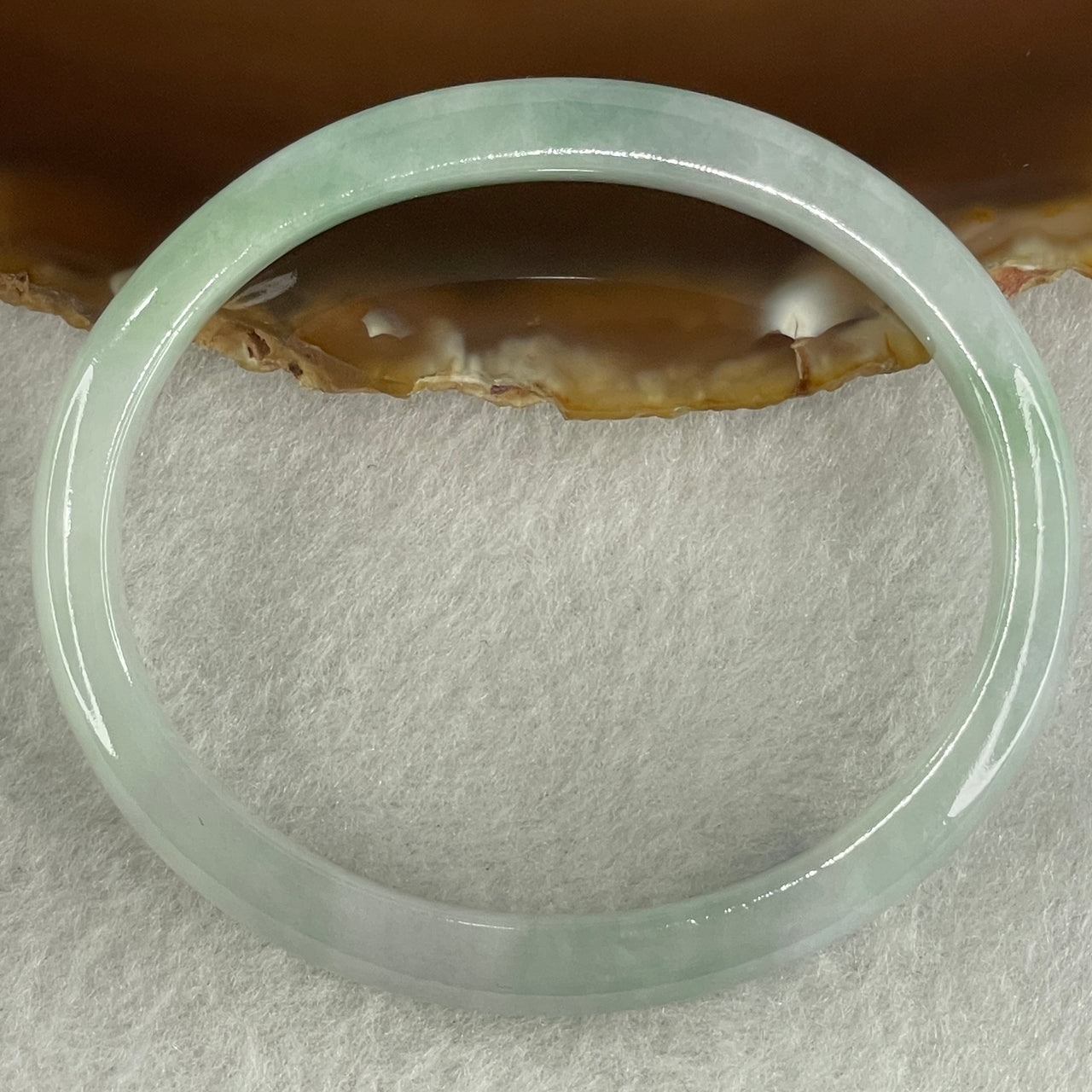 Certified Type A Light Green with Green Patches Jadeite Oval Bangle Internal Diameter 54.3mm 20.69g 7.5 by 6.4mm ( Very Slight Internal Lines )