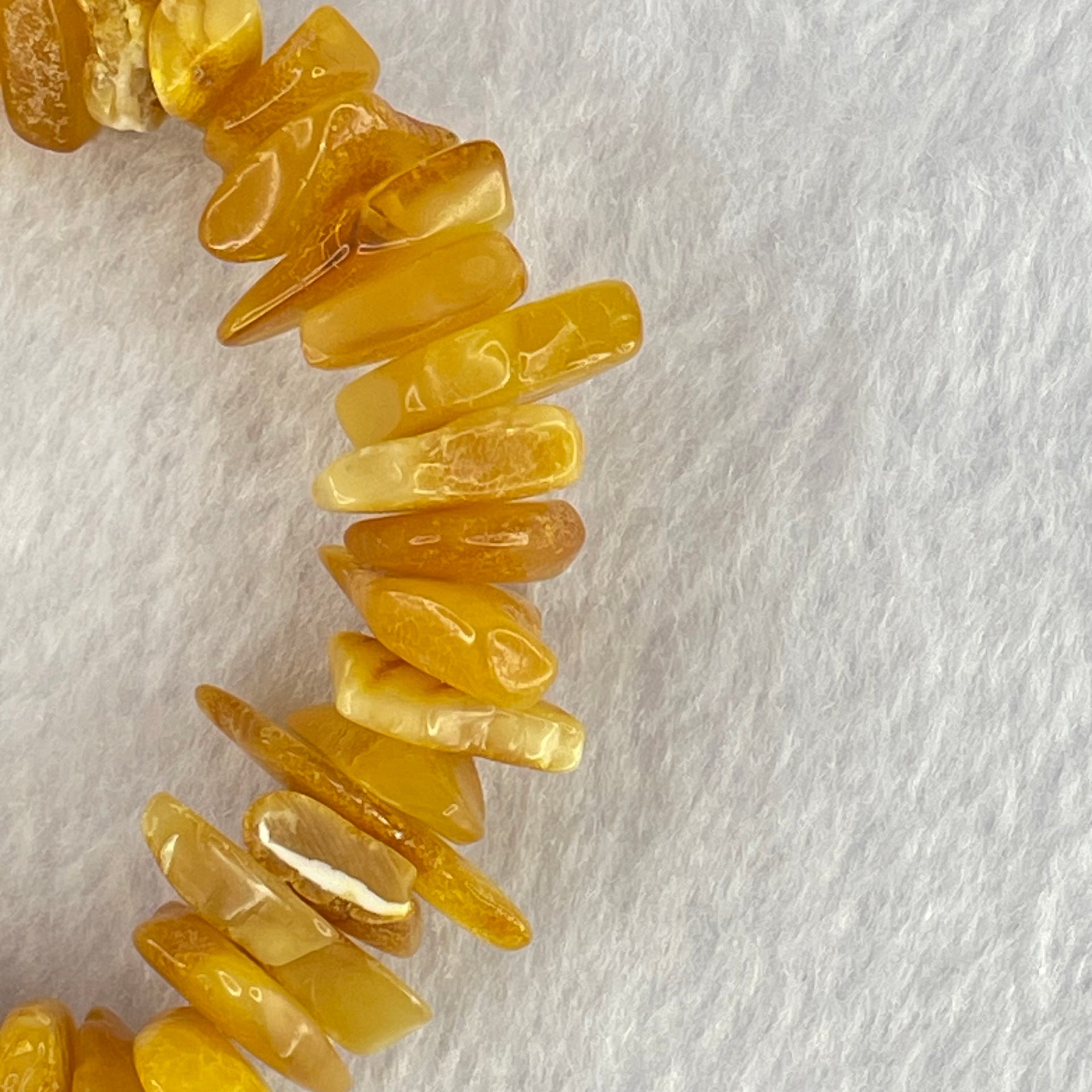 Natural Beeswax Raw Stone Irregular Beads Bracelet 天然蜜蜂蜡原石手链 22.59g 18.5cm 21.6 by 12.6 by 4.7mm, 13.1 by 11.7 by 4.8mm 54pcs - Huangs Jadeite and Jewelry Pte Ltd