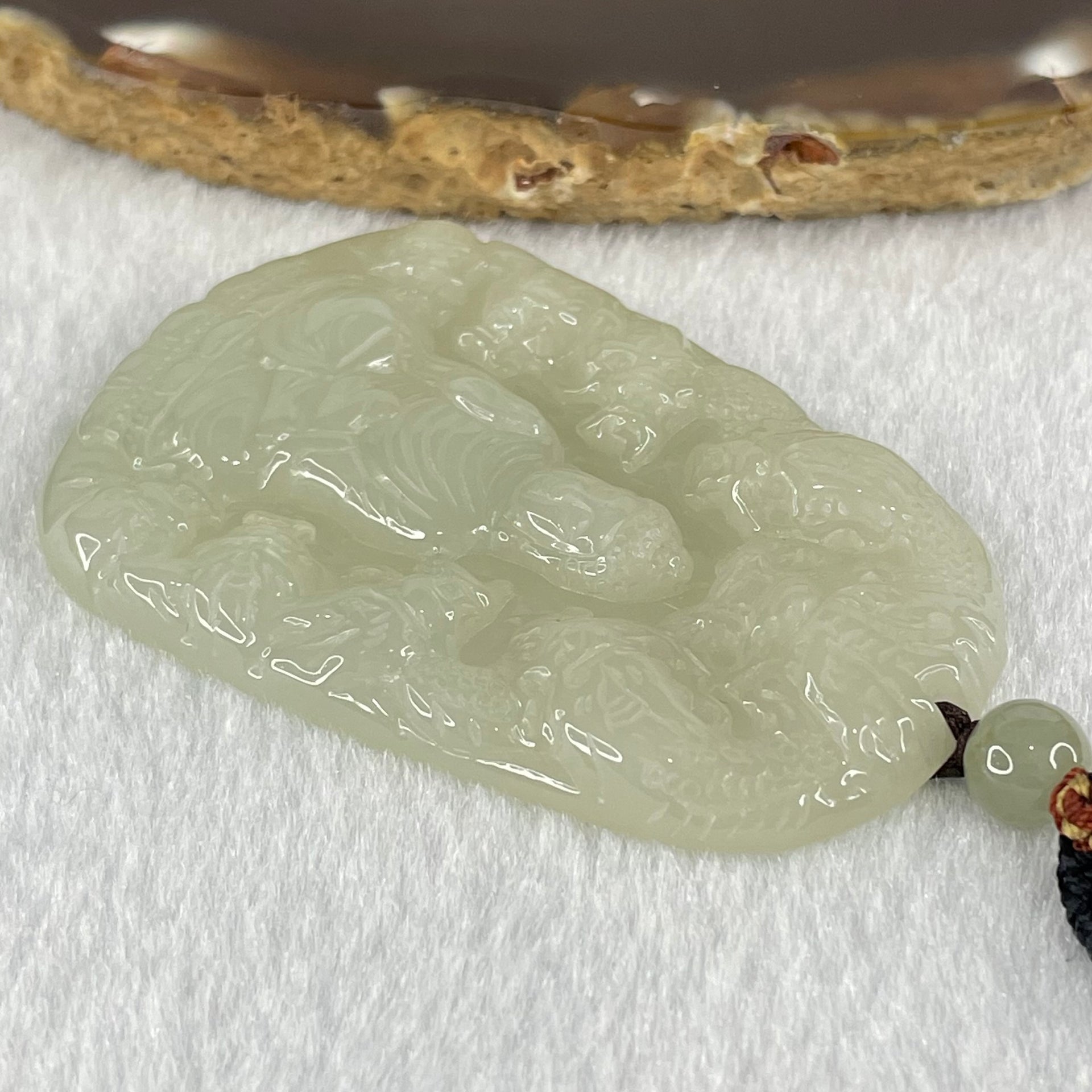 Type A Semi Icy Light Green Jadeite Buddha with 9 Dragons Pendant 27.39g 57.6 by 39.0 by 6.4mm - Huangs Jadeite and Jewelry Pte Ltd