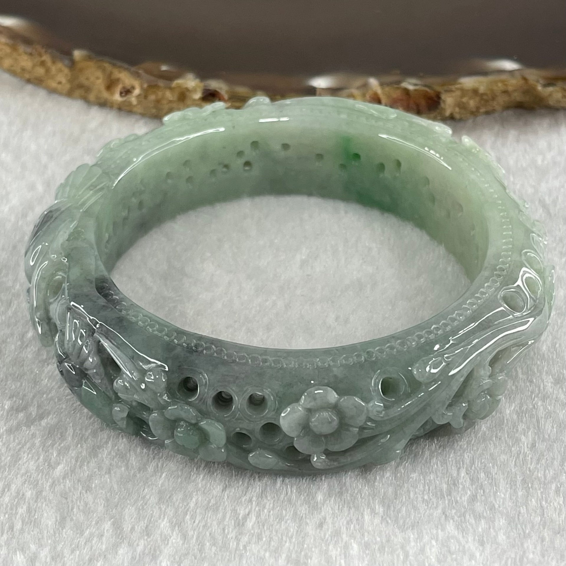 Type A Light to Dark Blueish Green Jadeite Carved with Prosperity Flowers Twin Birds and Butterfly Bangle 78.70g Internal Diameter 55.0mm 15.7 by 11.0mm - Huangs Jadeite and Jewelry Pte Ltd