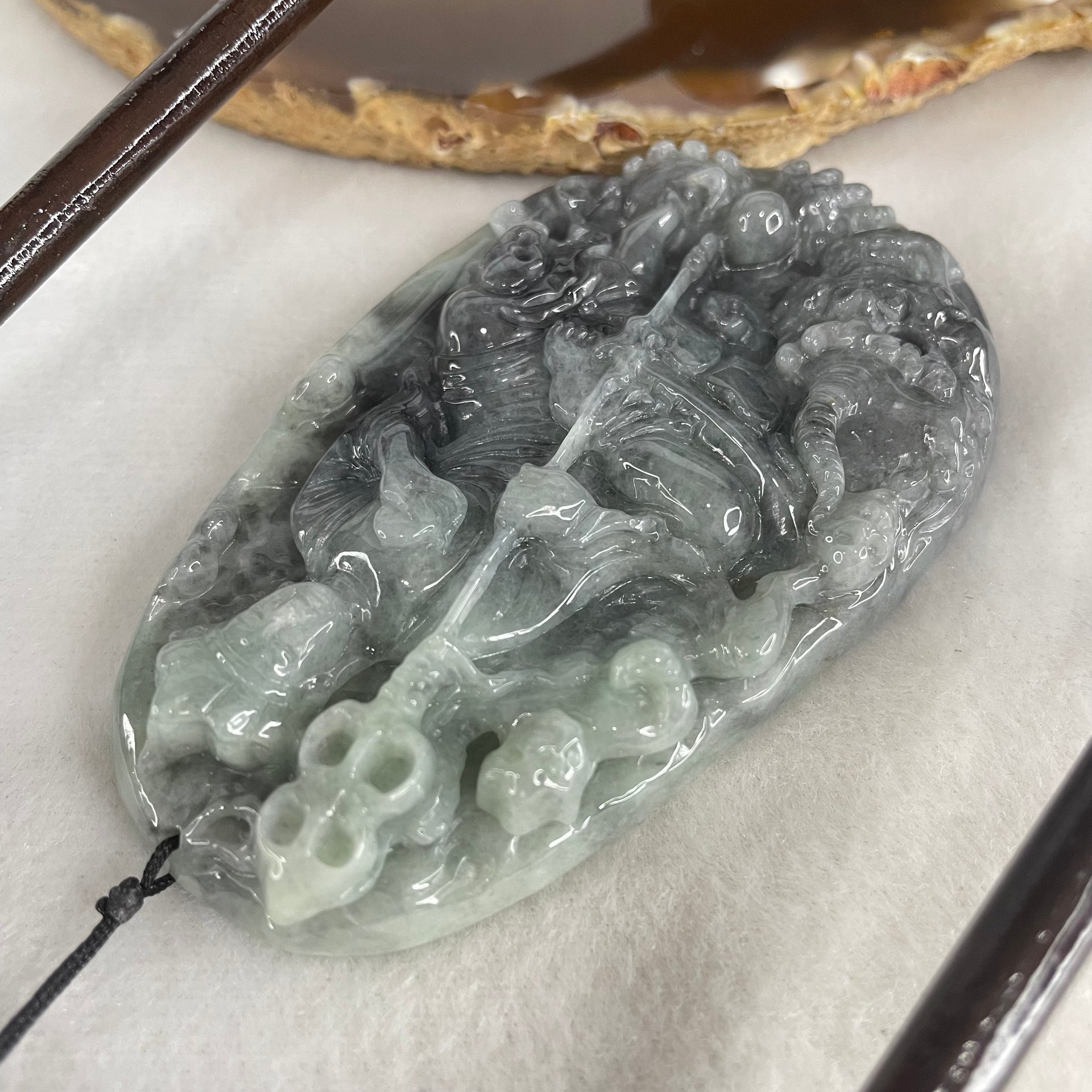 Type A Green With Wuji Grey Piao Hua Jadeite Ksitigarbha Bodhisattva, 地藏王菩萨, the Bodhisattva of Great Aspiration Display 178.8g 111.7 by 51.8 by 200.0mm - Huangs Jadeite and Jewelry Pte Ltd