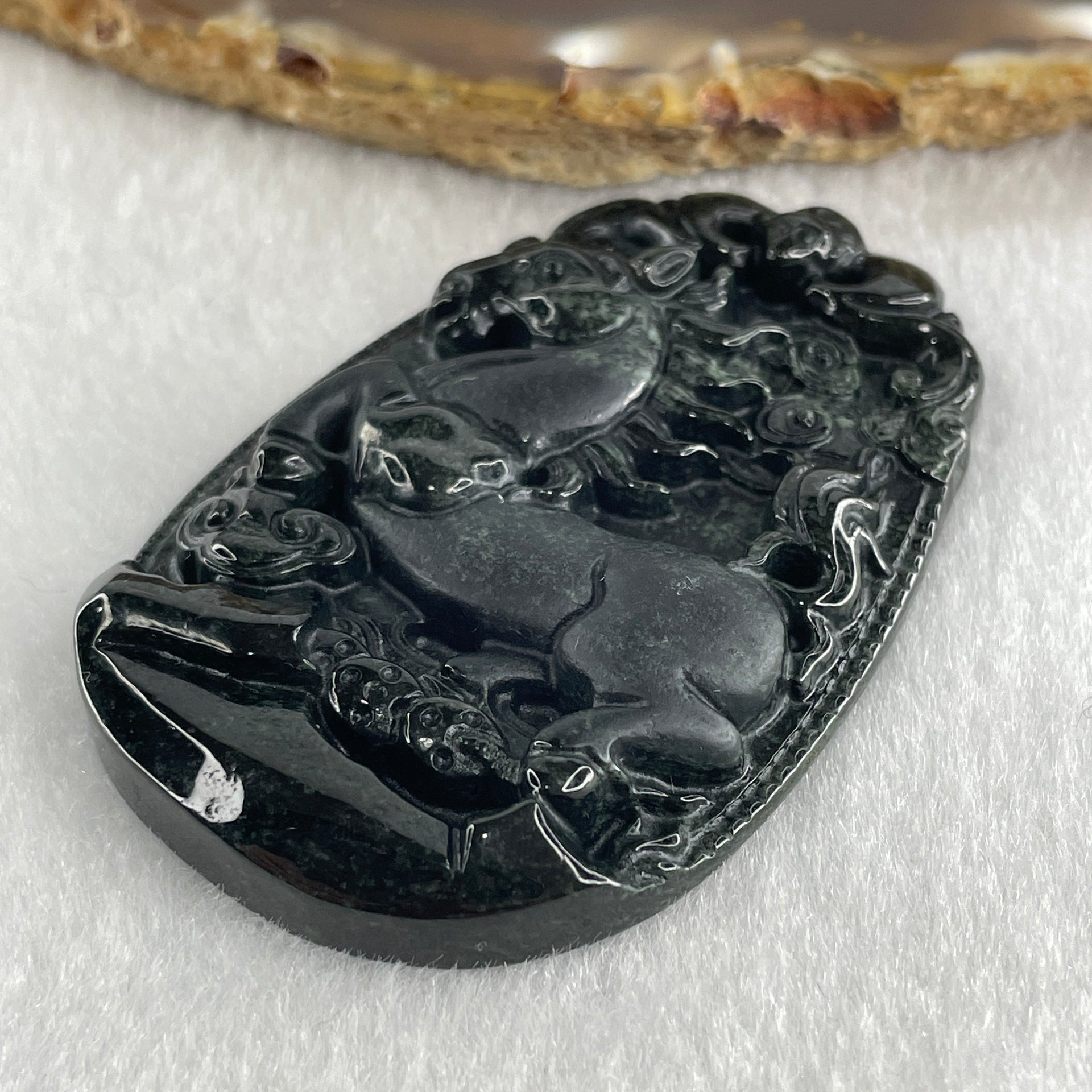 Type A Opaque to Partial Translucent Black Omphacite Jadeite Horse Pendant 26.34g 60.1 by 40.3 by 8.0mm - Huangs Jadeite and Jewelry Pte Ltd