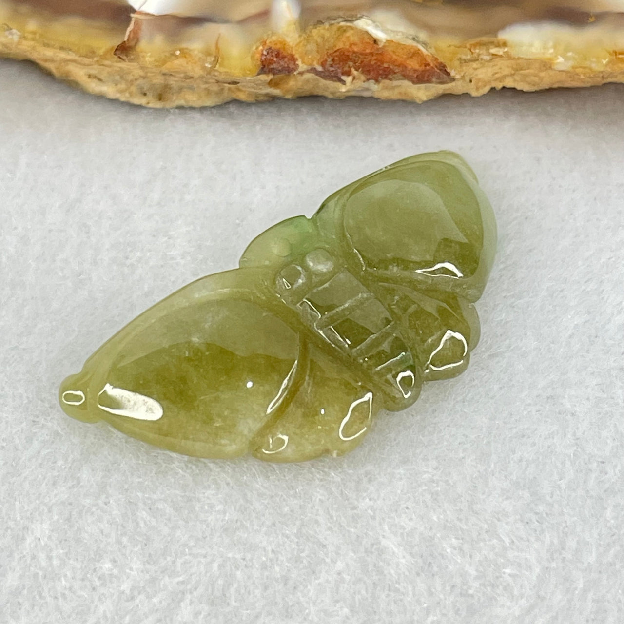 Type A Brownish Green Jadeite Butterfly Pendant 3.44g 32.9 by 14.8 by 6.1mm - Huangs Jadeite and Jewelry Pte Ltd