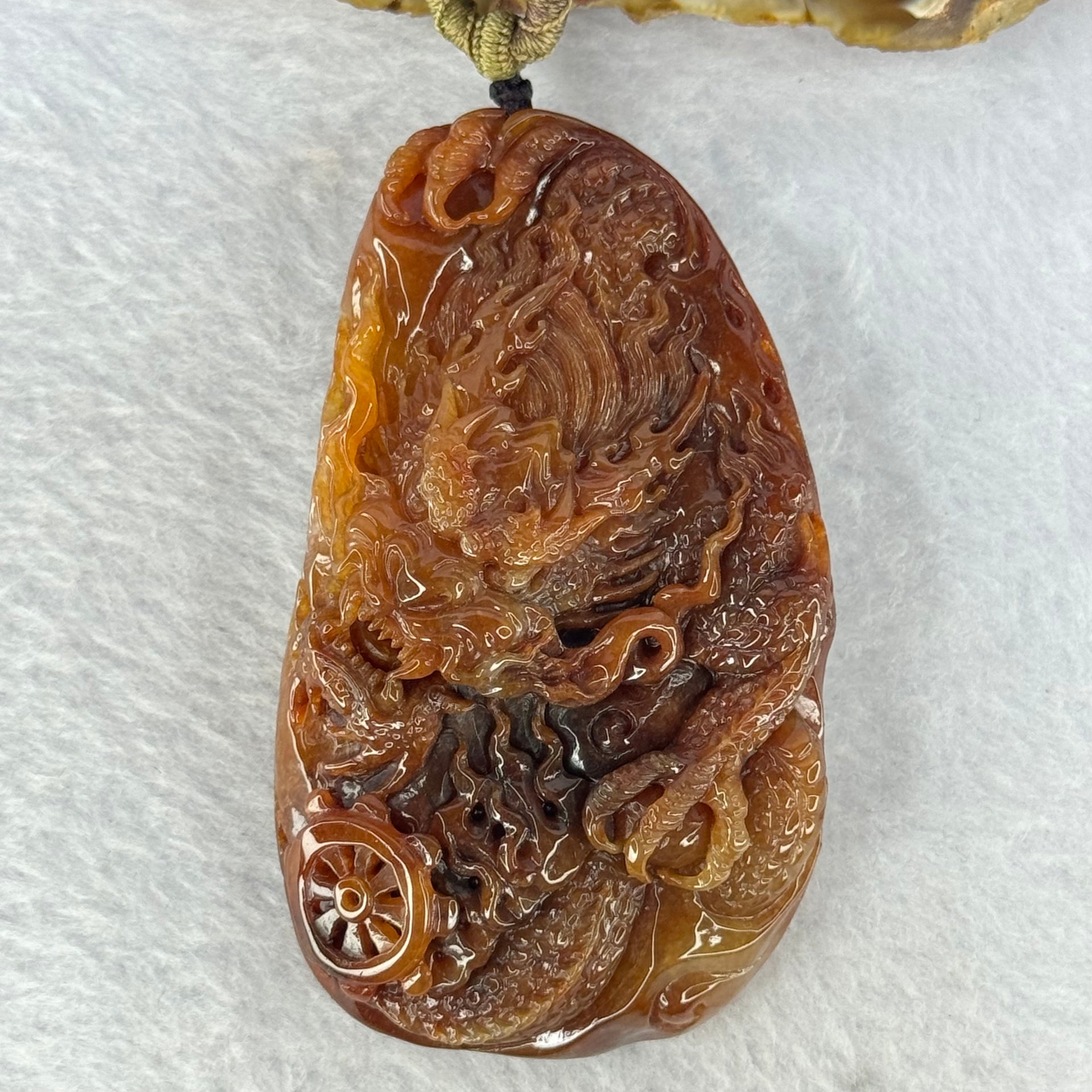 Grand Master Type A Red Jadeite Fire Dragon with Wheel 105.84g 81.5 by 47.0 by 17.5mm - Huangs Jadeite and Jewelry Pte Ltd