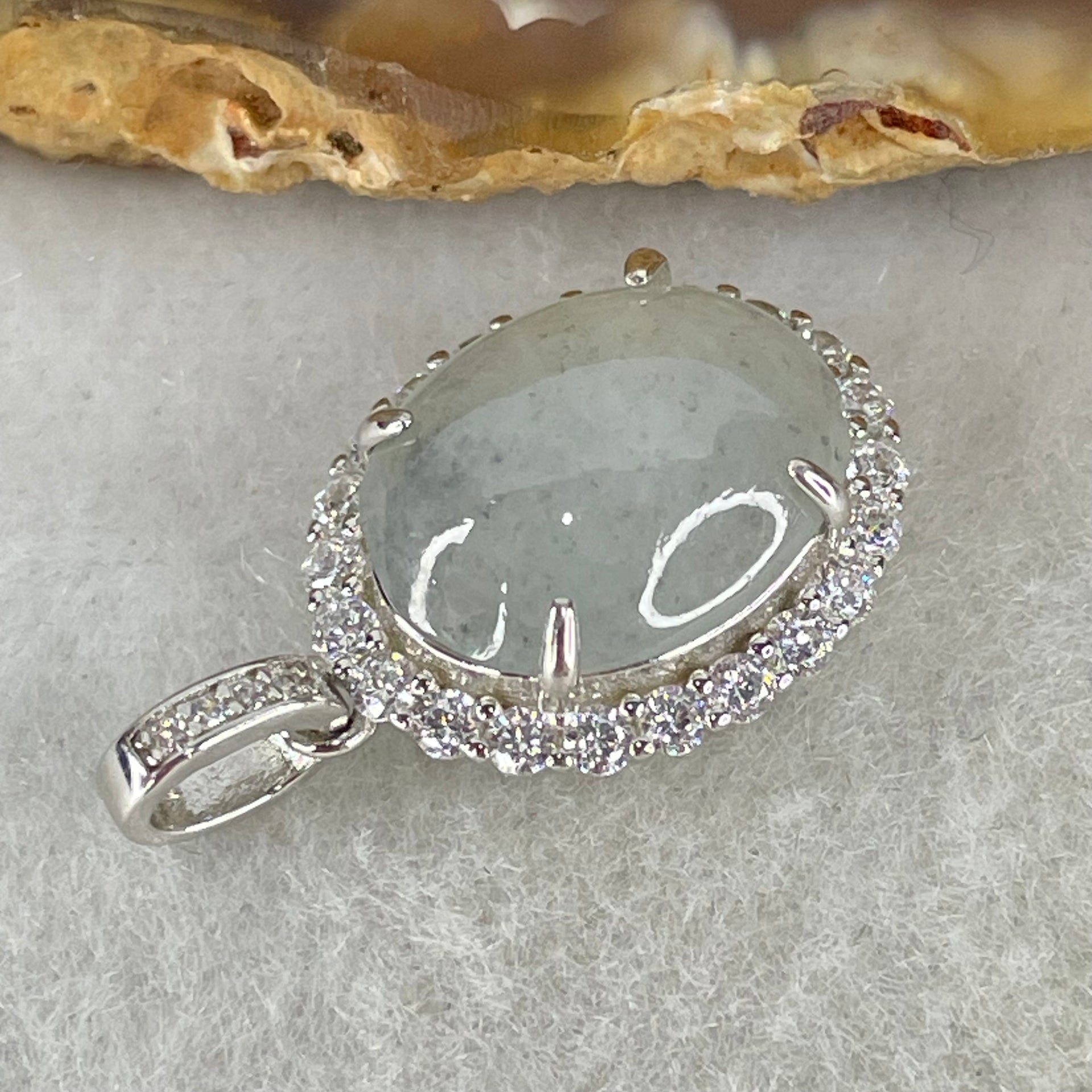 Type A Icy Green With Wuji Grey Spots Cabochon Jadeite in S925 Sliver Crystal Charm 2.85g 13.9 by 10.9 by 5.0mm - Huangs Jadeite and Jewelry Pte Ltd