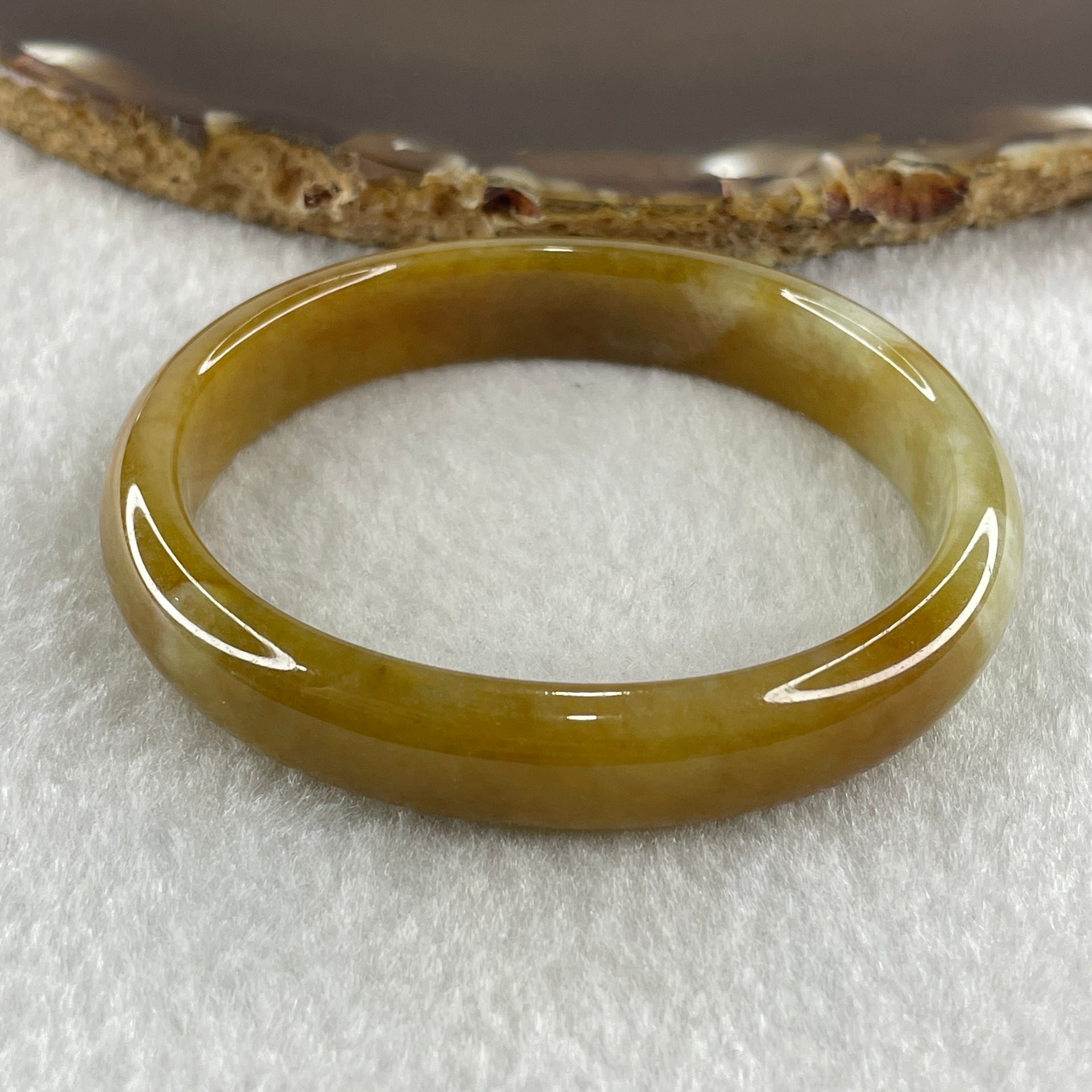 Type A Natural Intense Brownish Yellow Jadeite Oval Bangle 30.33g Inner Diameter 52.7mm 11.0 by 6.5mm (Very Slight Internal Lines) - Huangs Jadeite and Jewelry Pte Ltd