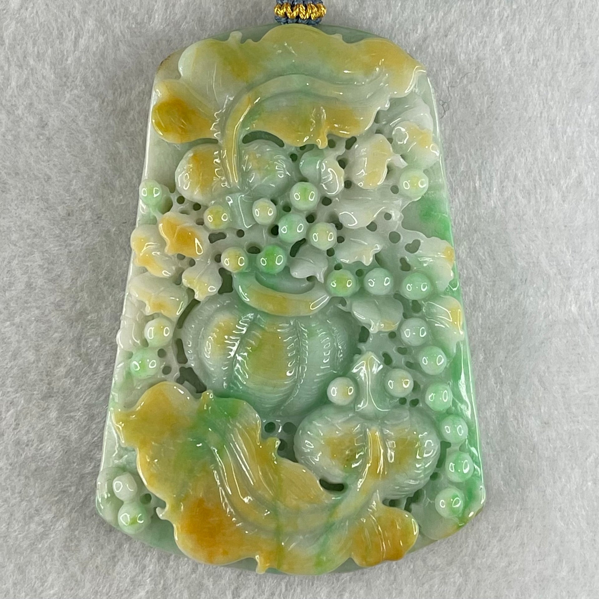 Grand Master Type A Green with Yellow Patches Jadeite Goldfish Pair and Basket of Flowers Pendant 连年有余 109.37g 76.2 by 53.5 by 12.3mm - Huangs Jadeite and Jewelry Pte Ltd