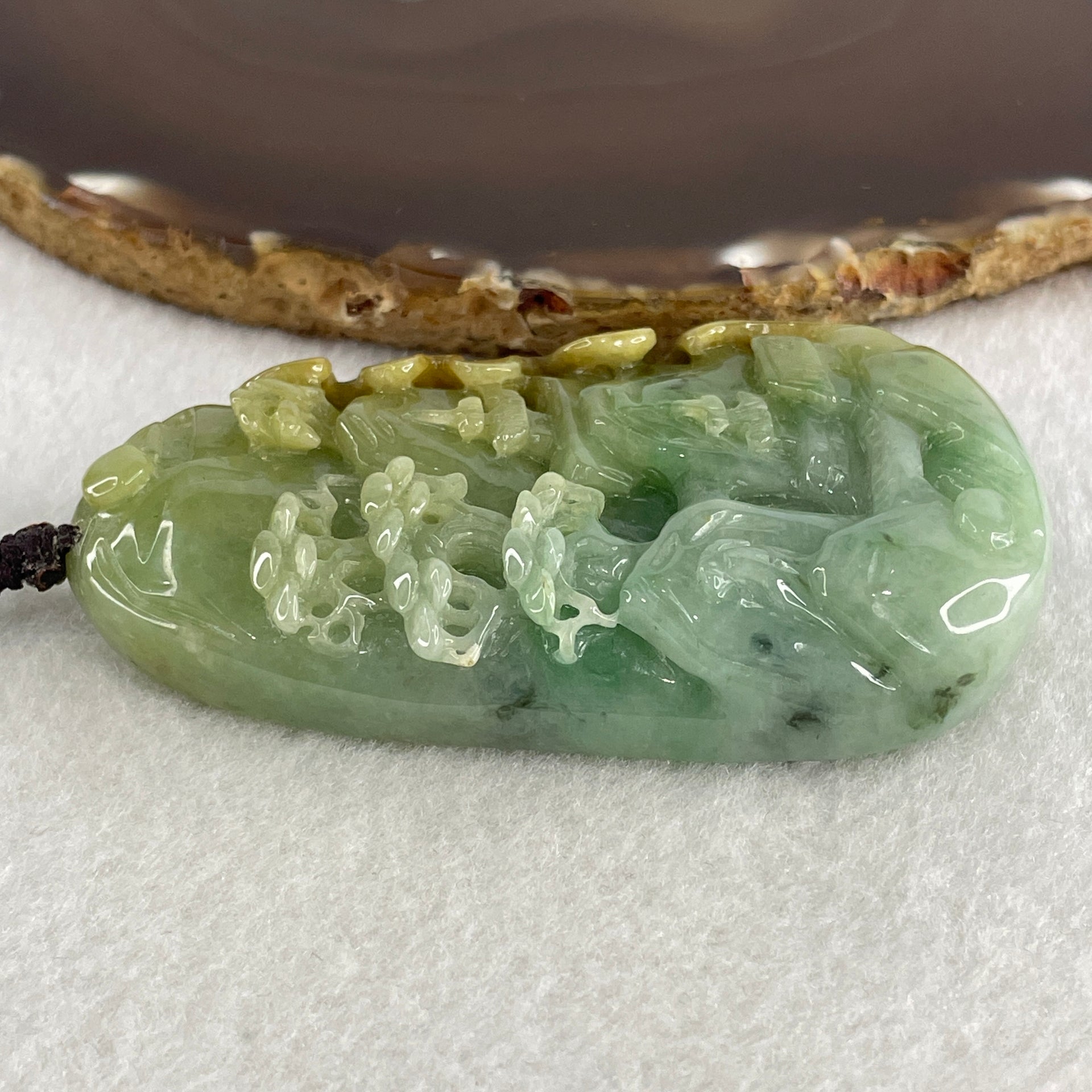 Natural Type A Green with Yellowish Jadeite Shan Shui with Gui Ren Pendant 127.68g 75.0 by 44.7 by 14.7mm - Huangs Jadeite and Jewelry Pte Ltd
