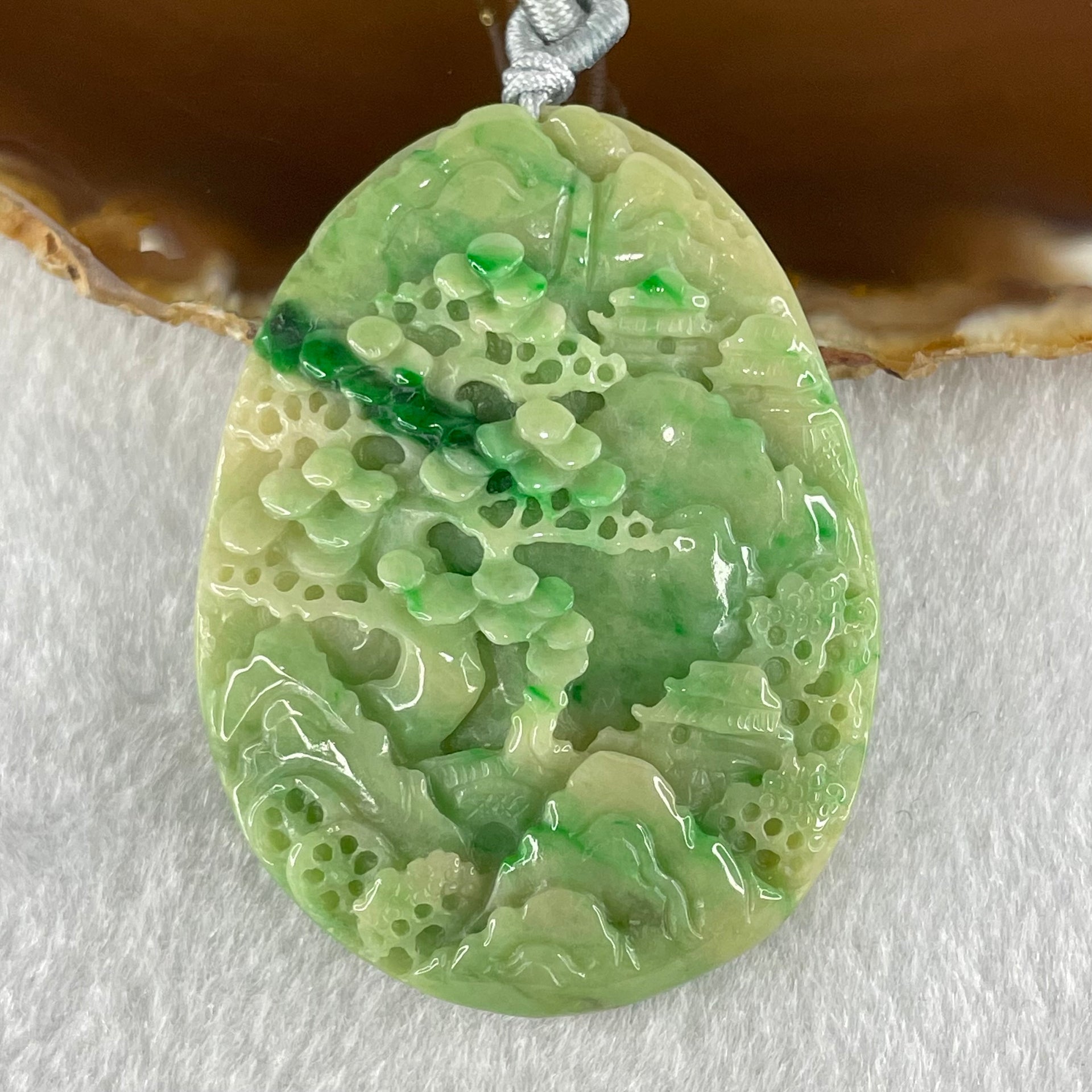 Type A Green with Yellow Spicy Green Piao Hua and Light Brown Patches Jadeite Double Sided Shan Shui with Gui Ren Benefactor Pendant 30.43g 54.0 by 40.8 by 8.4mm - Huangs Jadeite and Jewelry Pte Ltd