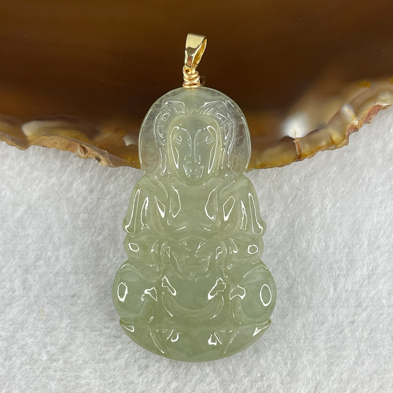 Natural Type A Icy Light Green Jadeite Guan Yin Pendant in Gold Color Stainless Steel Clasp 9.16g 43.5 by 26.0 by 4.9mm - Huangs Jadeite and Jewelry Pte Ltd