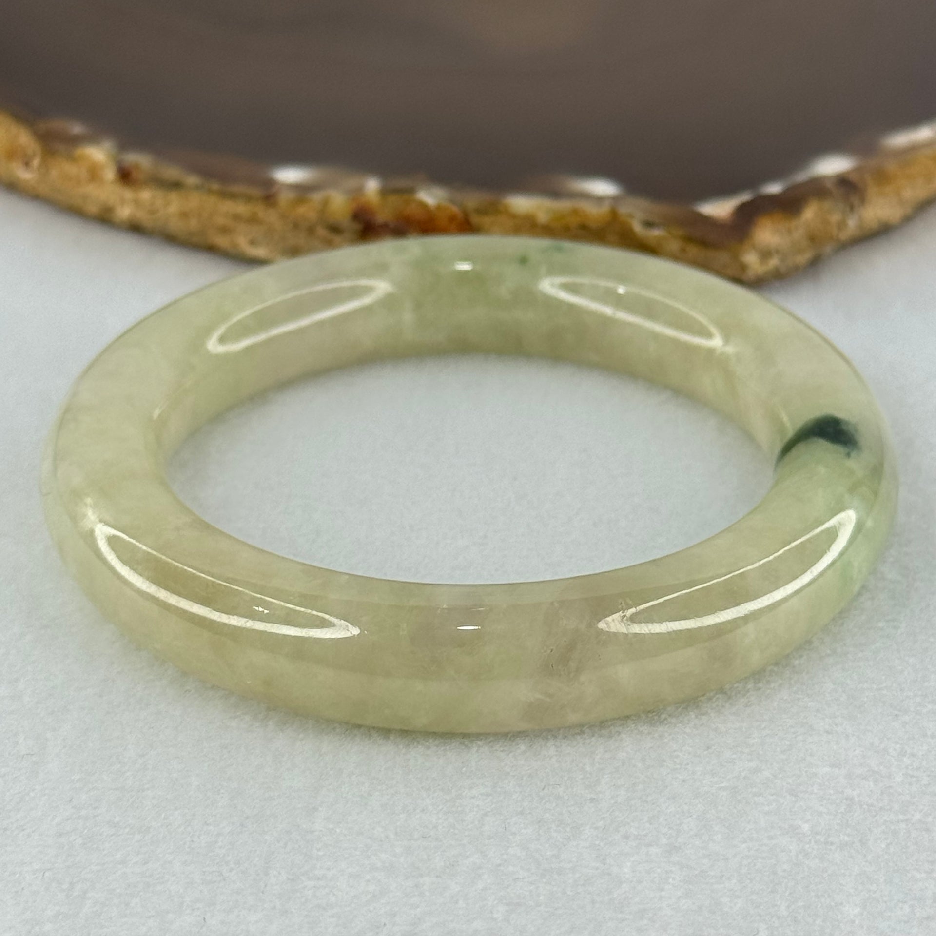 Type A Translucent Semi Icy Light Yellowish Green with Moss Green Patch Jadeite Bangle Internal Diameter 55.3mm 76.40g 12.3 by 11.6mm (Very Slight External Rough) - Huangs Jadeite and Jewelry Pte Ltd