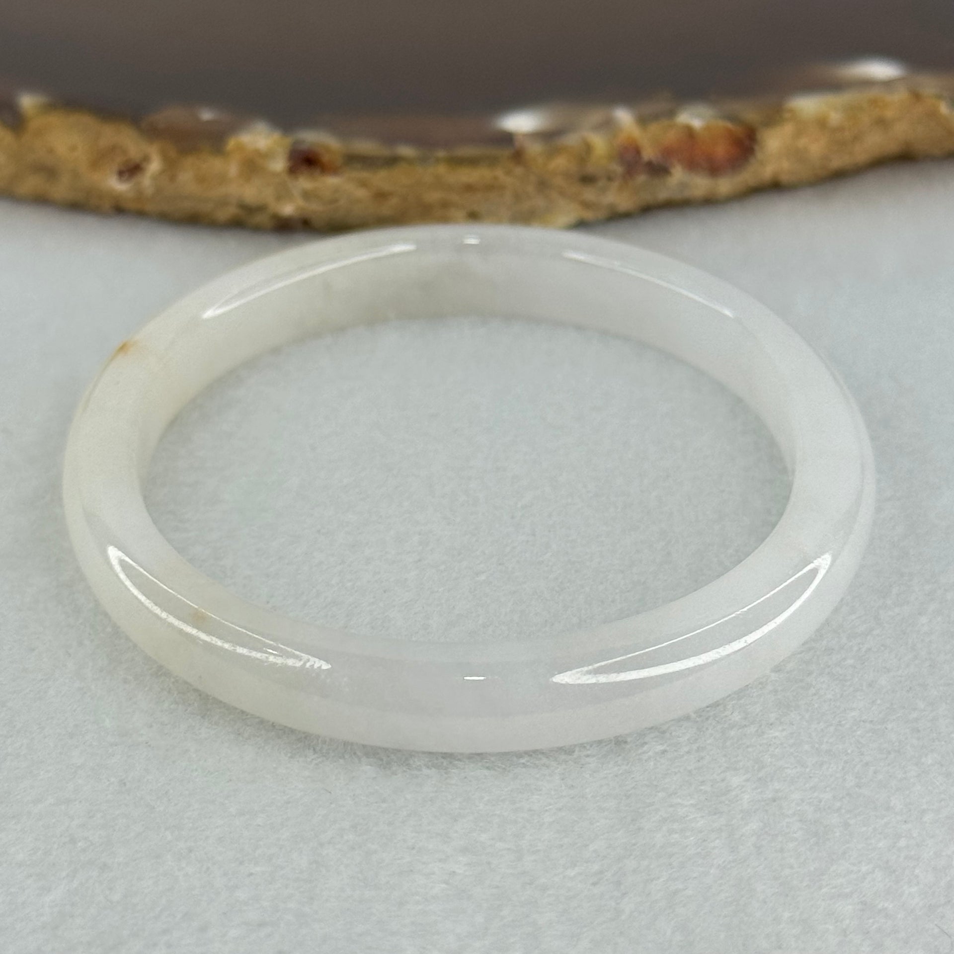 Type A Semi Icy Faint Lavender Green with Reddish Spot Jadeite Oval Bangle Internal Diameter 54.4mm 21.33g 7.5 by 6.0mm (very slight internal line) - Huangs Jadeite and Jewelry Pte Ltd