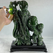 Natural Dark Green Serpentine Shou Xing Gong and Tong Zi and Longevity Peach with Wooden Stand Display 3,091.3g 193.0 by 95.0 by 257.0mm - Huangs Jadeite and Jewelry Pte Ltd