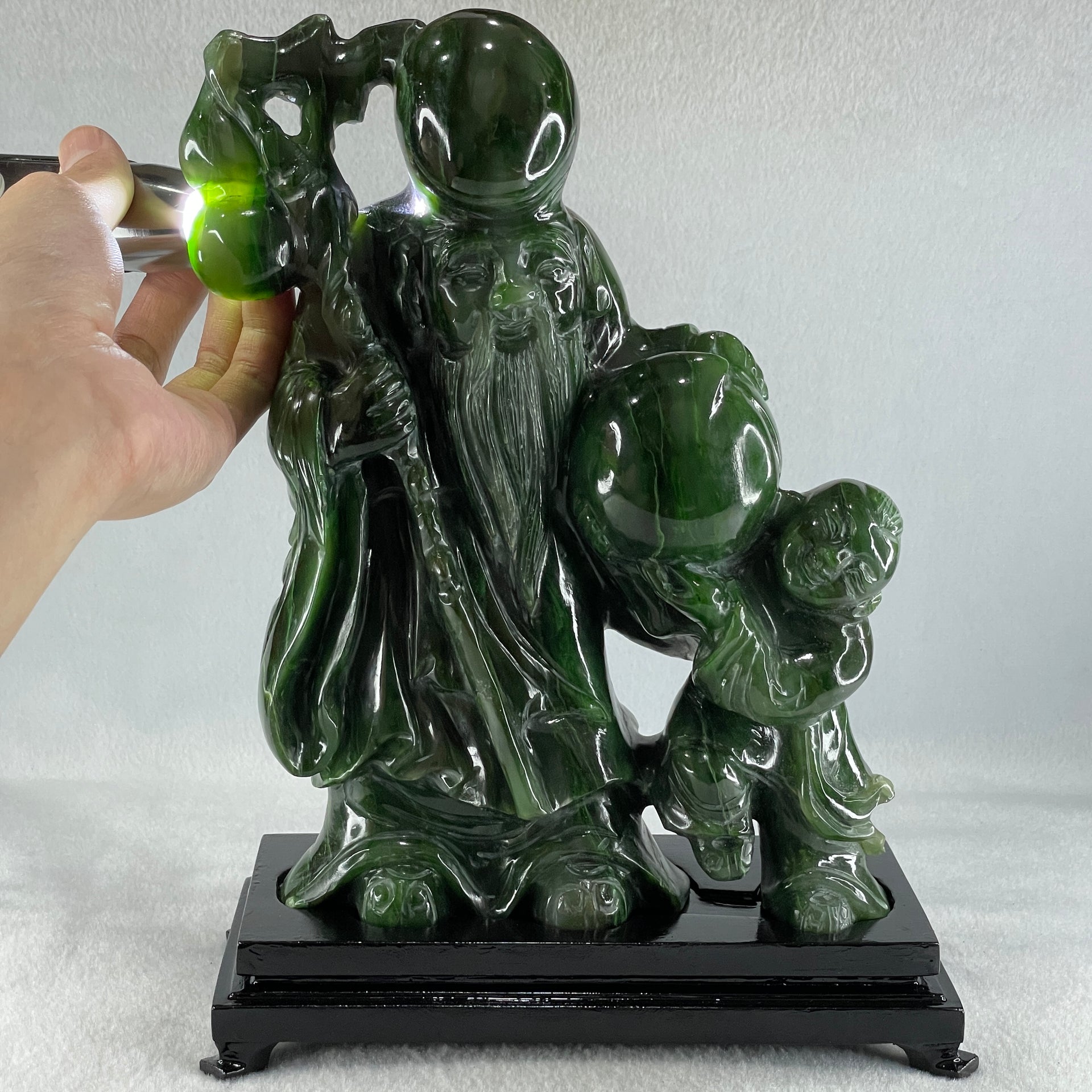 Natural Dark Green Serpentine Shou Xing Gong and Tong Zi and Longevity Peach with Wooden Stand Display 3,091.3g 193.0 by 95.0 by 257.0mm - Huangs Jadeite and Jewelry Pte Ltd