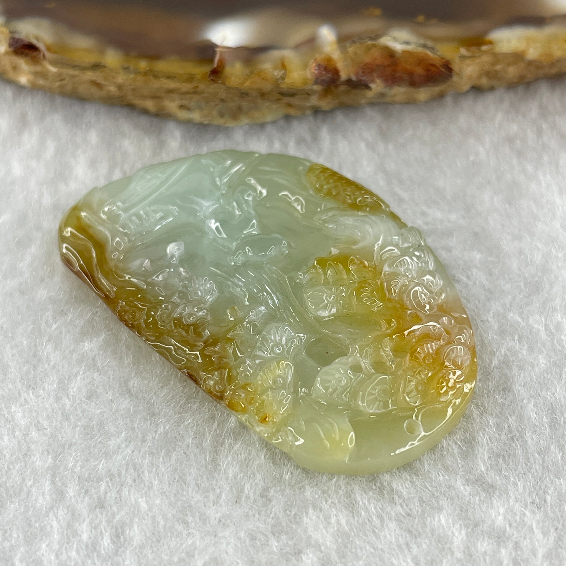 Type A Natural Semi Icy Light Green with Yellow Patches Jadeite Shan Shui Gui Ren Benefactor Pendant 9.79g 38.2 by 25.6 by 6.0mm - Huangs Jadeite and Jewelry Pte Ltd