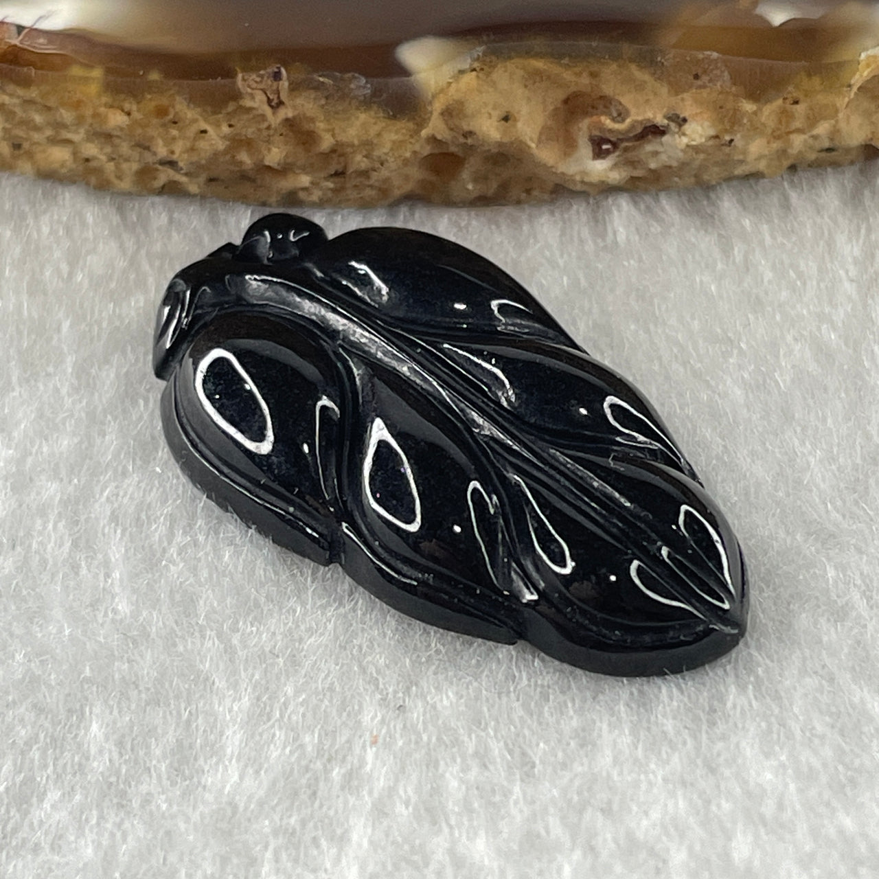 Type A Opaque Black Omphacite Leaf Pendant Charm 5.60g 31.5 by 18.0 by 5.7mm - Huangs Jadeite and Jewelry Pte Ltd