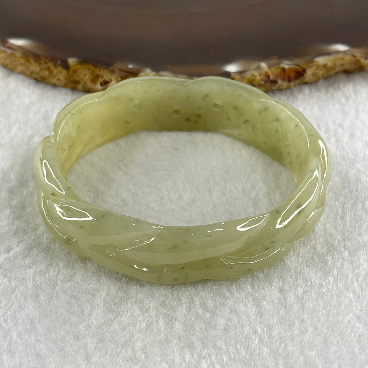 Type A Natural Yellowish Green Jadeite Oval Carved Bangle 41.73g Inner Diameter 54.2mm 16.5 by 7.1mm (Very Very Slight Internal Lines) - Huangs Jadeite and Jewelry Pte Ltd