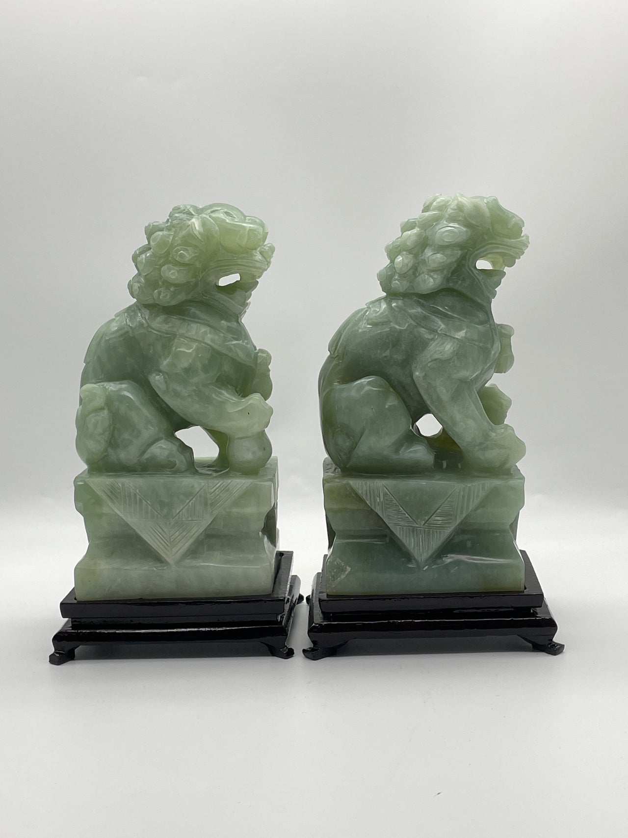 Natural Green Serpentine Pair of Fu Gou with Wooden Stand Display 2,753.4g 131.0 by 105.0 by 235.0mm and 2,790.0g 125.5 by 106.0 by 230.0mm