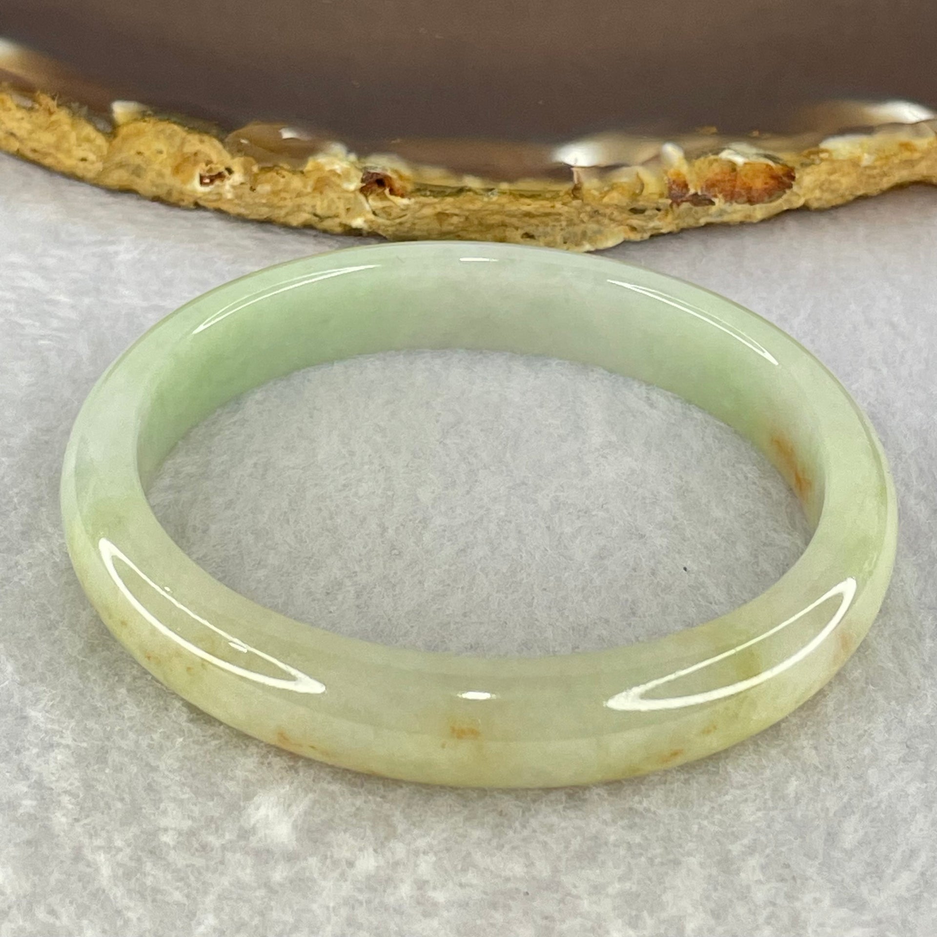 Type A Light Blueish Green and Red and Brown Patches Jadeite Oval Bangle Internal Diameter 54.3mm 32.17g 10.4 by 6.5mm (Very Slight Internal Lines) - Huangs Jadeite and Jewelry Pte Ltd