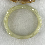 Type A Natural Yellowish Green Jadeite Oval Carved Bangle 41.73g Inner Diameter 54.2mm 16.5 by 7.1mm (Very Very Slight Internal Lines) - Huangs Jadeite and Jewelry Pte Ltd