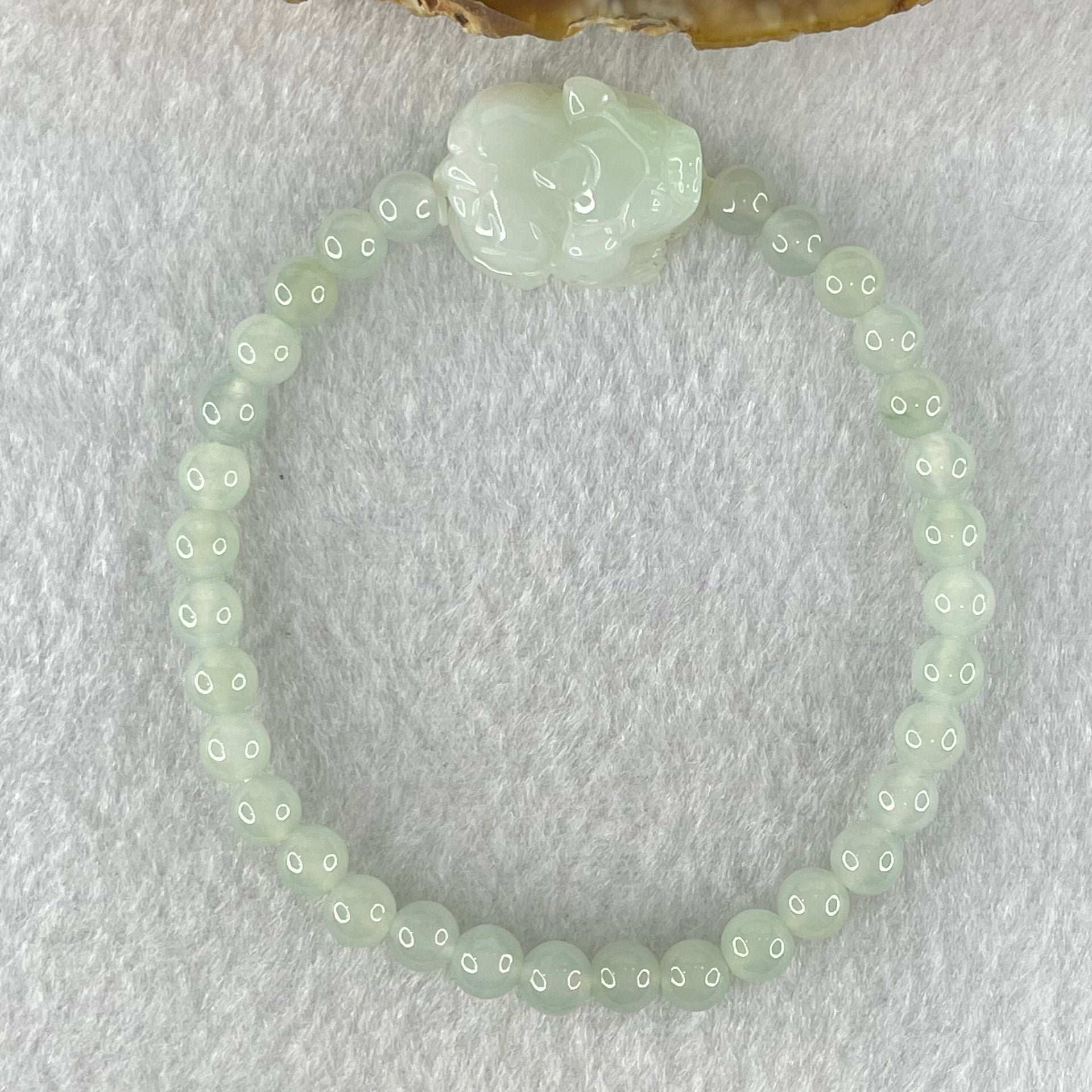 Type A Light Blueish Green Jadeite Beads with Faint Lavender Green Male Pixiu Charm Bracelet 13.83g 16.5cm 5.4mm 32 Beads 20.0 by 15.6 by 10.0mm - Huangs Jadeite and Jewelry Pte Ltd