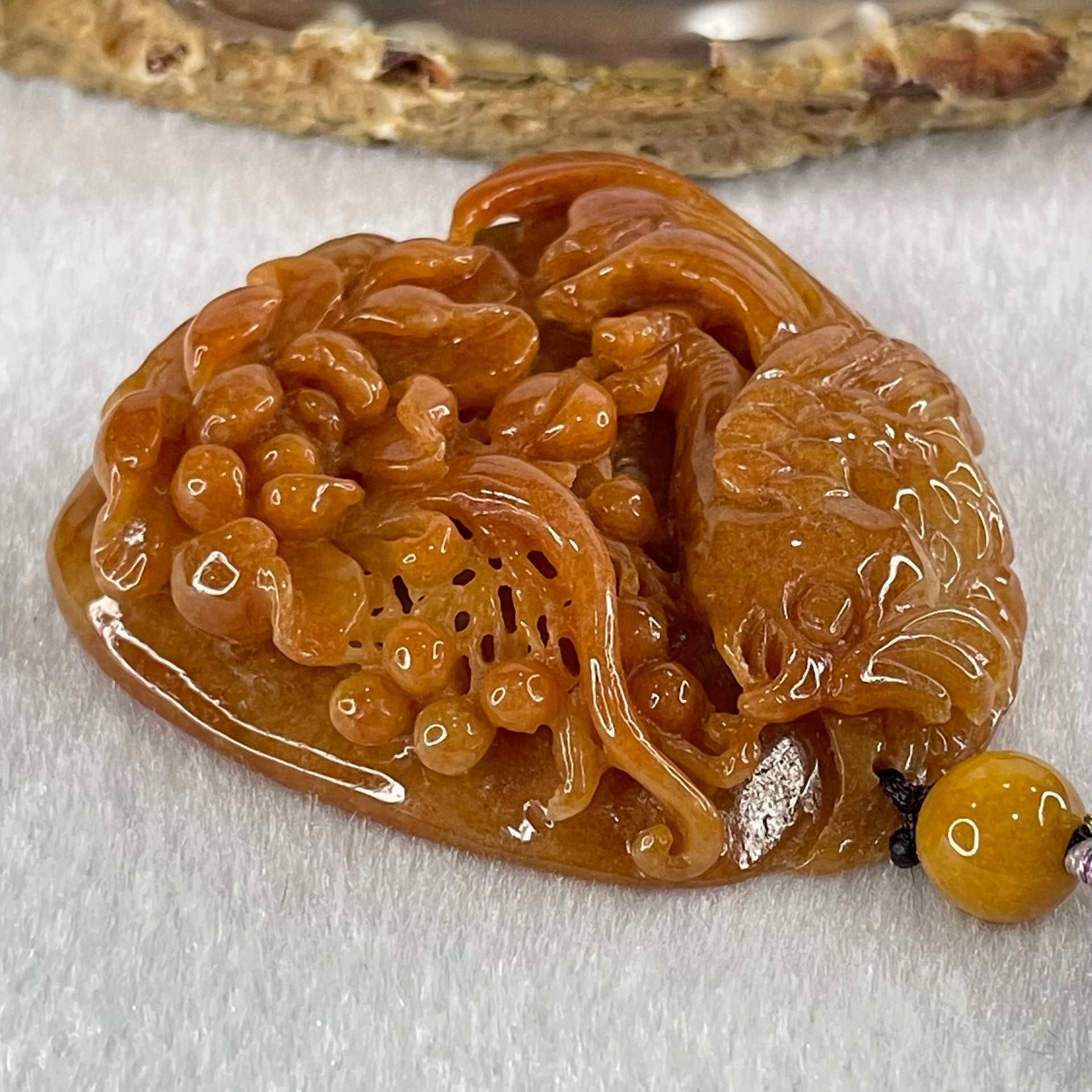 Grandmaster Type A Translucent Brownish Orange to Brownish Red with Light Blueish Green Jadeite Bird with Flower 花开富贵 Pendant 53.67g 49.27 by 46.37 by 12.66mm With NGI Cert 82838746 - Huangs Jadeite and Jewelry Pte Ltd