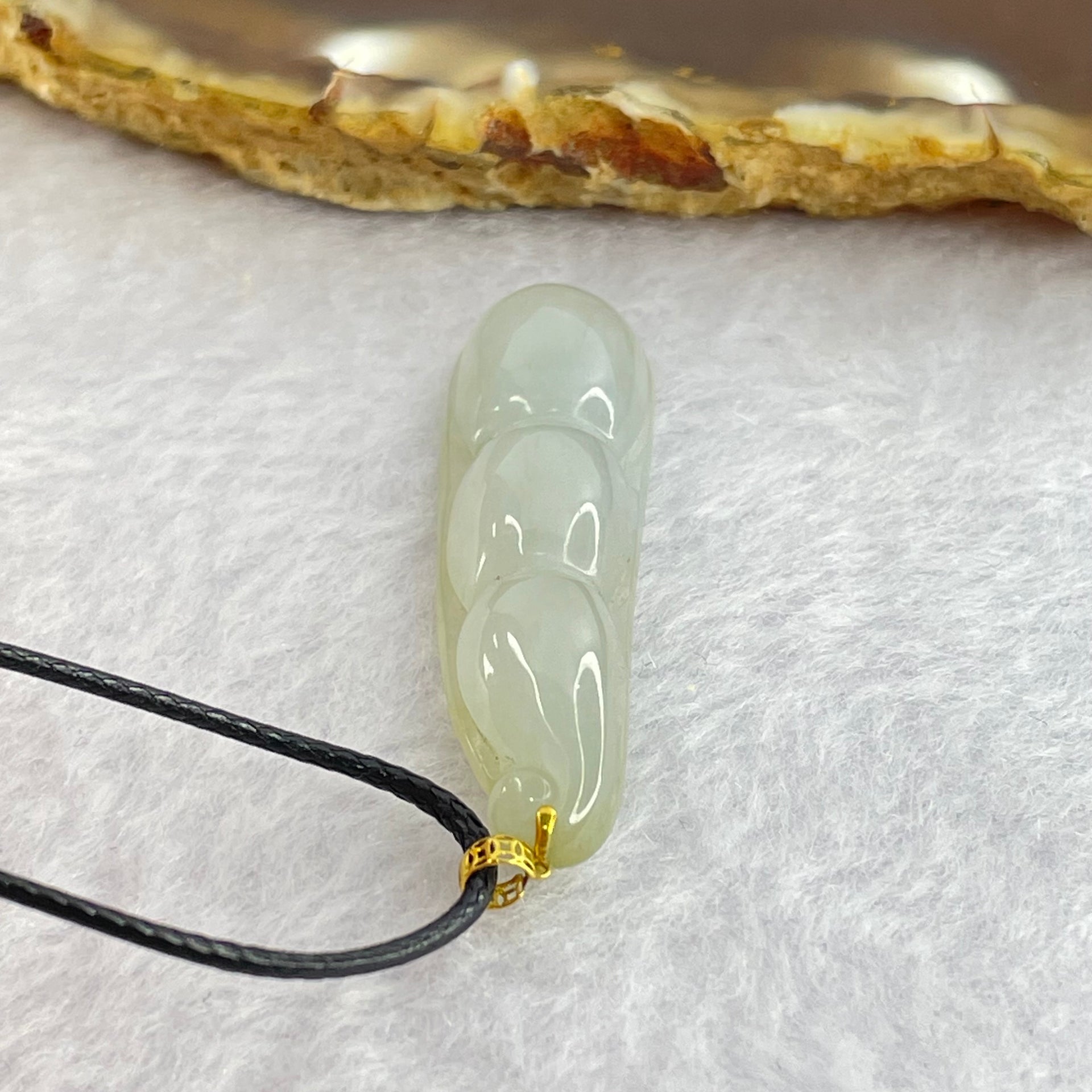 Type A Faint Green Jadeite Peapod Pendent 6.17g 39.1 by 11.3 by 7.1mm - Huangs Jadeite and Jewelry Pte Ltd