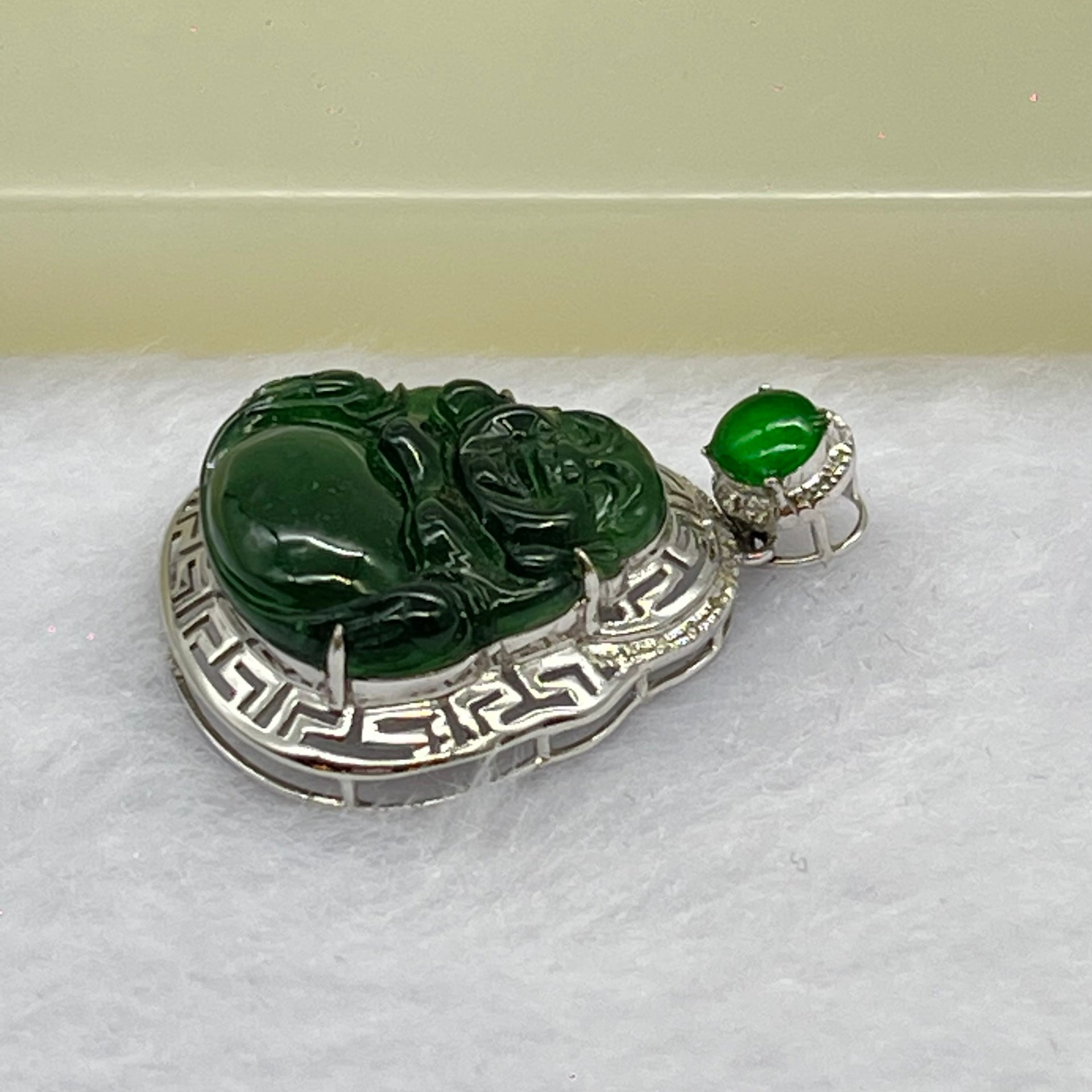 Type A Blueish Green Jadeite Milo Buddha Pendant Setting 18k White Gold 2.45g 25.6 by 19.4 by 7.2mm - Huangs Jadeite and Jewelry Pte Ltd