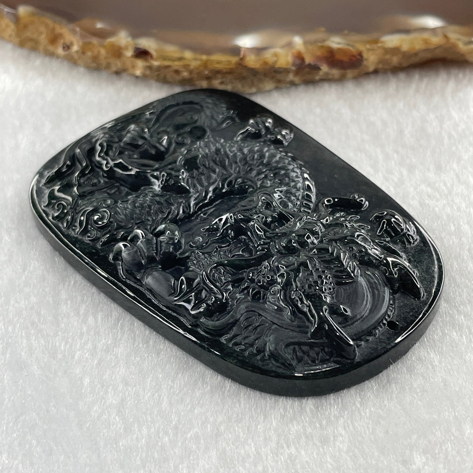 Type A Opaque to Partial Translucent Black Omphacite Jadeite Dragon Pendant 34.19g 66.8 by 45.5 by 9.4mm - Huangs Jadeite and Jewelry Pte Ltd
