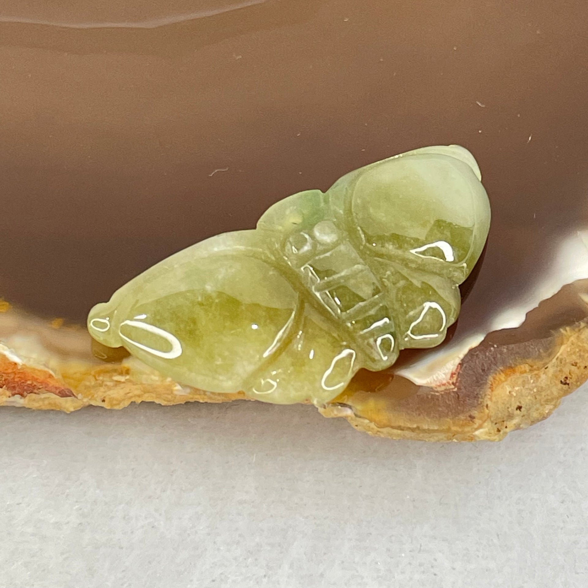 Type A Brownish Green Jadeite Butterfly Pendant 3.44g 32.9 by 14.8 by 6.1mm - Huangs Jadeite and Jewelry Pte Ltd