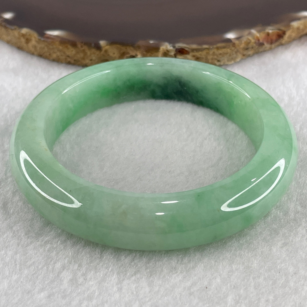 Certified Natural Type A Light Apple Green with Emerald Green Fluorite Piao Hua Jadeite Bangle 75.87g Internal Diameter 58.0mm 13.5 by 10.0mm ( Slight Internal Line)