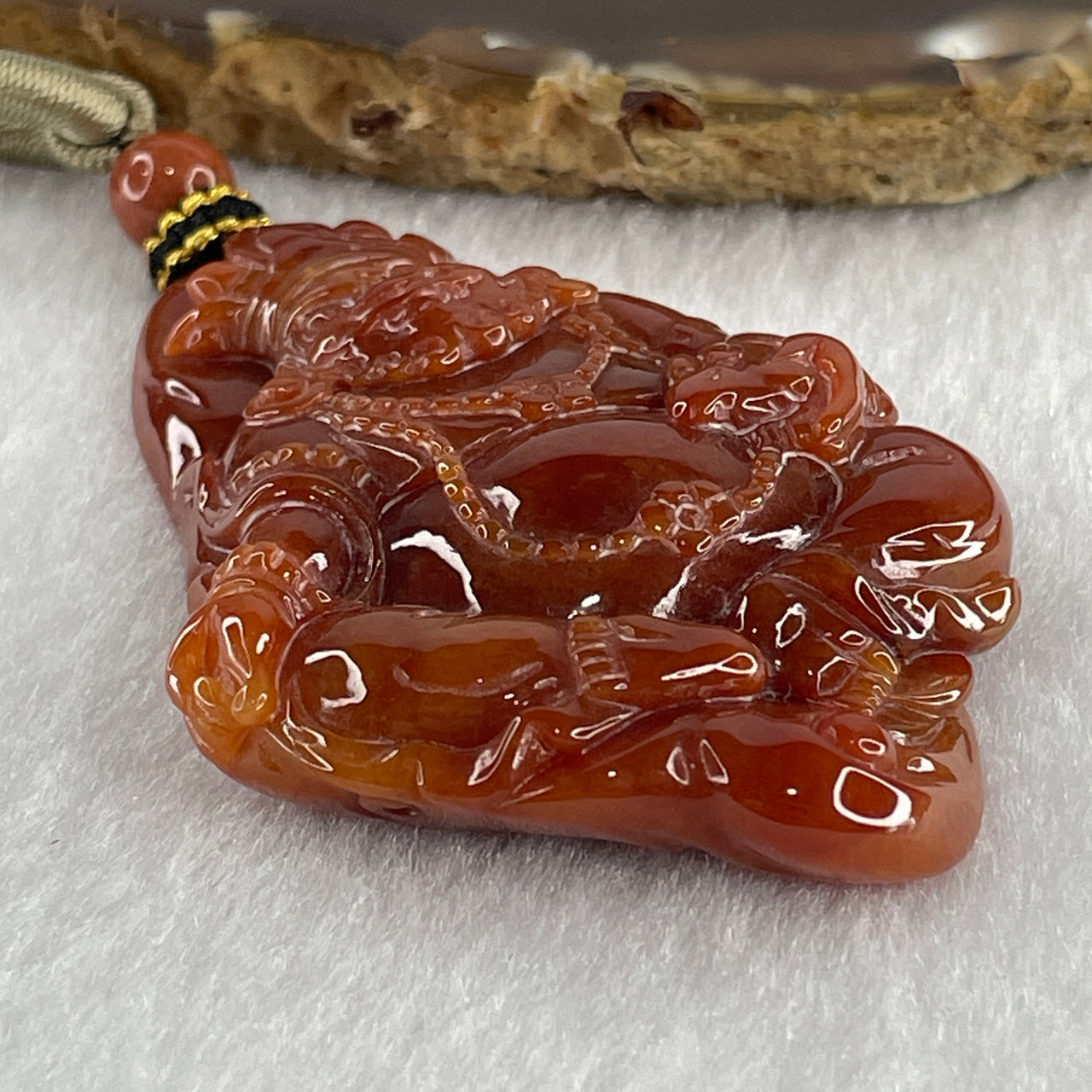 Type A Brownish Red Jadeite Jambhala Pendant 50.23g 63.6 by 45.6 by 1.5mm
