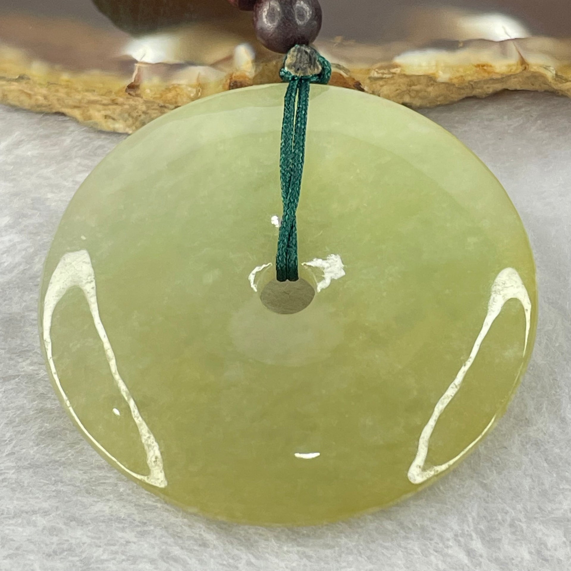 Type A Yellowish Green Jadeite Ping An Kou Donut Pendent 24.41g 43.0 by 7.1mm - Huangs Jadeite and Jewelry Pte Ltd