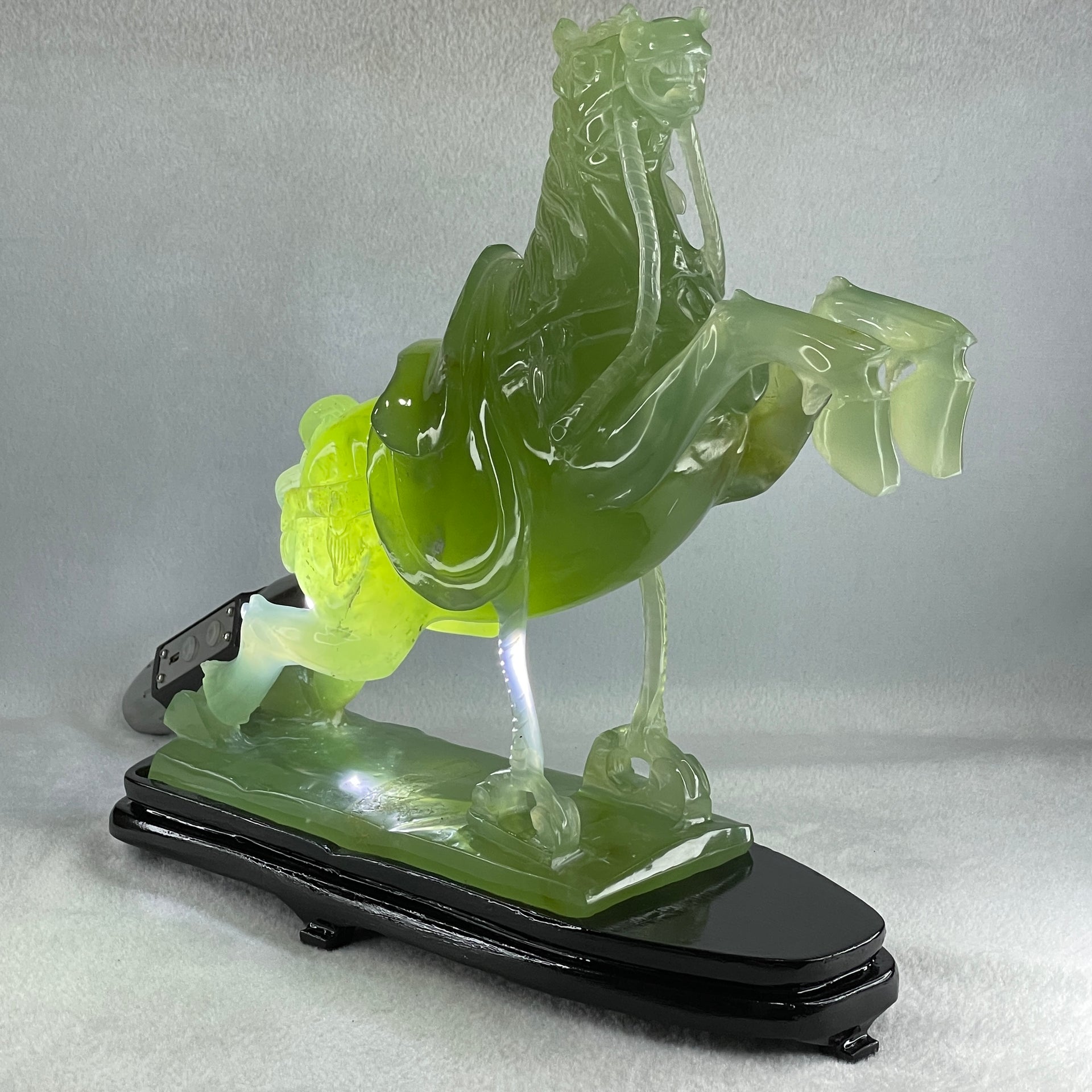Natural Semi Icy Green Serpentine Victory Horse with Wooden Stand Display 2,644.2g 270.0 by 96.0 by 260.0mm - Huangs Jadeite and Jewelry Pte Ltd
