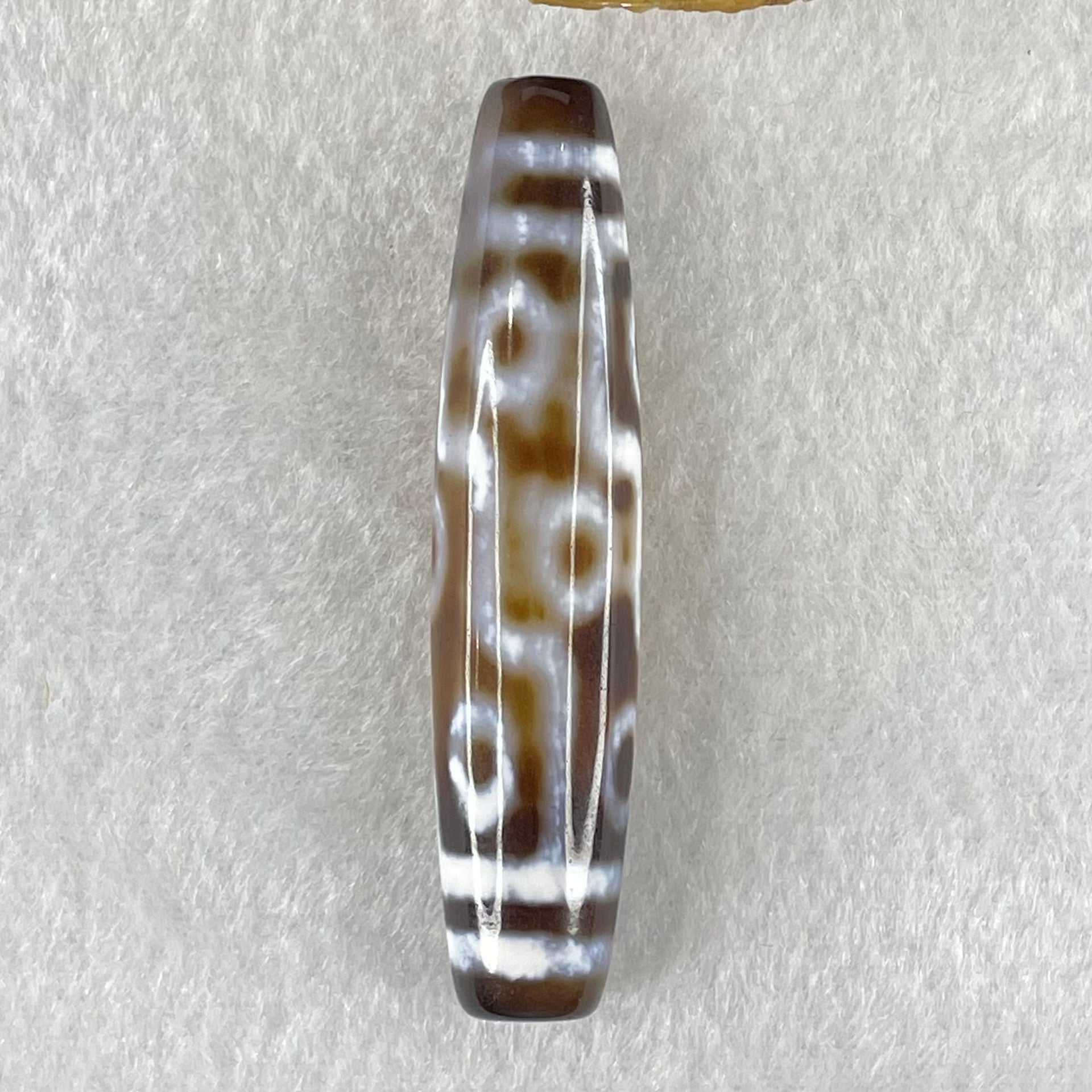 Natural Powerful Tibetan Old Oily Agate Zha Ji La Mu Female Cai Shen Carvings on 9 Eyes Dzi Bead Heavenly Master (Tian Zhu) 九眼扎基拉姆女财神天珠 14.46g 58.4 by 13.0mm - Huangs Jadeite and Jewelry Pte Ltd