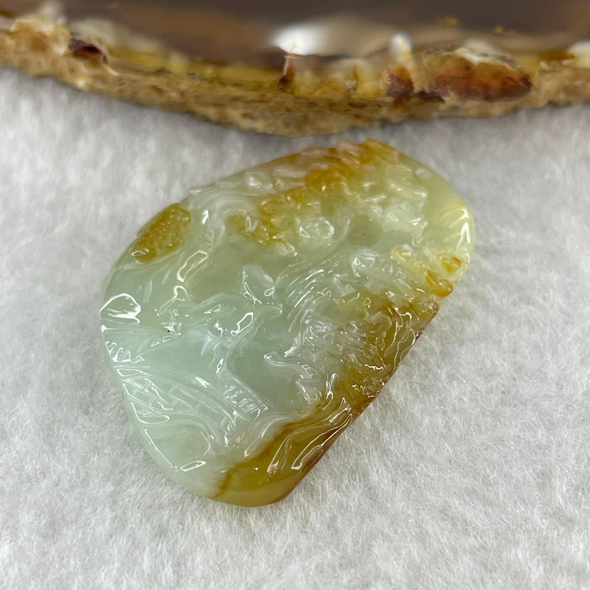 Type A Natural Semi Icy Light Green with Yellow Patches Jadeite Shan Shui Gui Ren Benefactor Pendant 9.79g 38.2 by 25.6 by 6.0mm - Huangs Jadeite and Jewelry Pte Ltd
